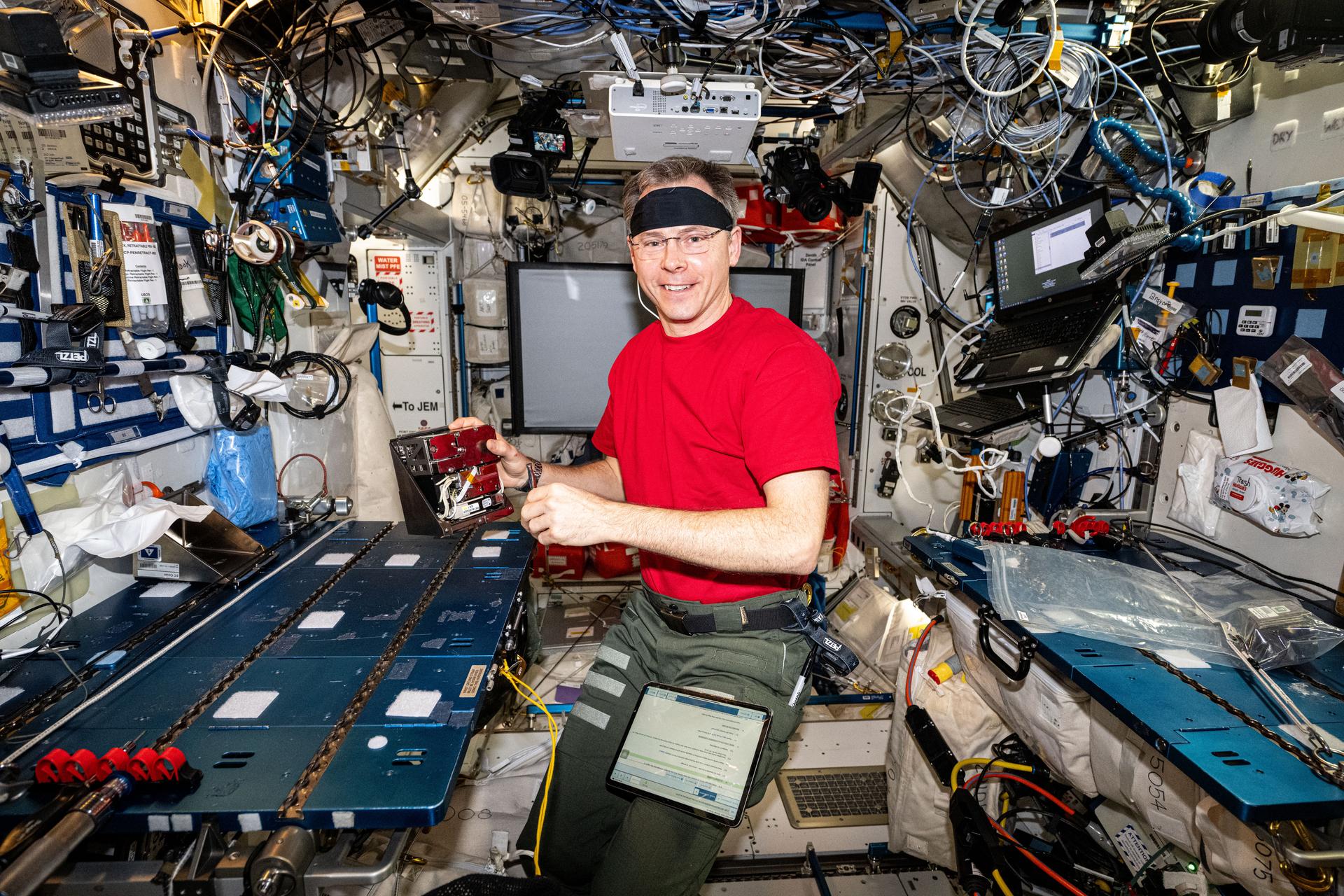 NASA astronaut and Expedition 72 Flight Engineer Nick Hague processes samples of micro-algae at the Harmony module's maintenance work area aboard the International Space Station. The Arthrospira C biotechnology investigation exposes micro-algae to cosmic radiation and microgravity to learn how to revitalize the spacecraft environment using photosynthesis and produce fresh food on long-term space missions.