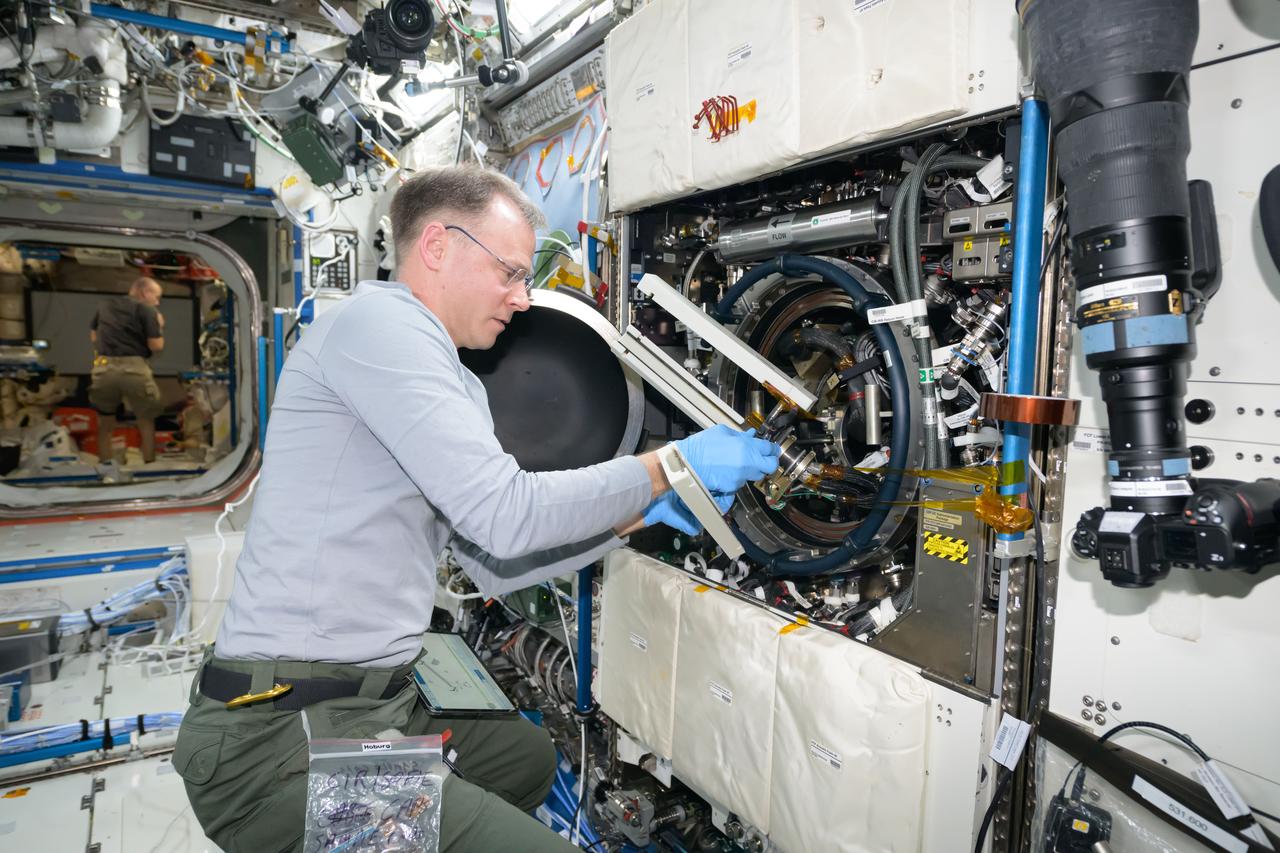 iss072e456120 (Jan. 13, 2025) --- NASA astronaut and Expedition 72 Flight Engineer Nick Hague works in the Destiny laboratory module's Combustion Integrated Rack swapping samples of materials to observe how they burn in weightlessness. The investigation taking place inside the International Space Station's CIR enables the safe observation of flames and how they spread in microgravity potentially improving fire safety on crew missions.