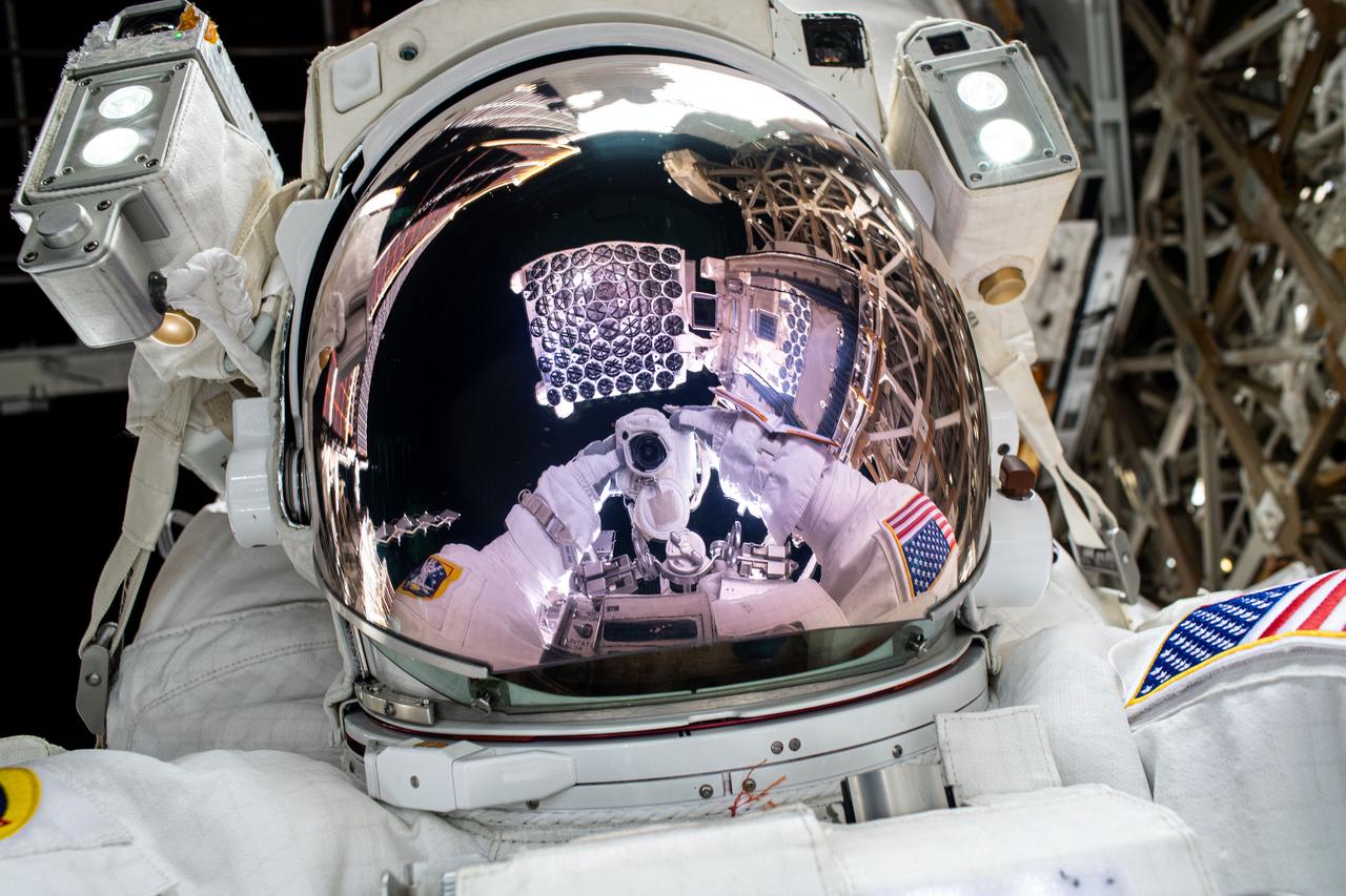 iss072e487911 (Jan. 16, 2025) --- The NICER X-ray telescope is reflected on NASA astronaut and Expedition 72 Flight Engineer Nick Hague's spacesuit helmet visor in this high-flying "space-selfie." Also, visible in Hague's visor is the camera he is pointing toward himself to take this photograph. During the six-hour spacewalk, Hague patched light leaks on some of NICER's 56 X-ray concentrators that block ultraviolet, infrared, and visible light while allowing X-rays to pass through to the mirrors underneath enabling the observation of neutron stars.