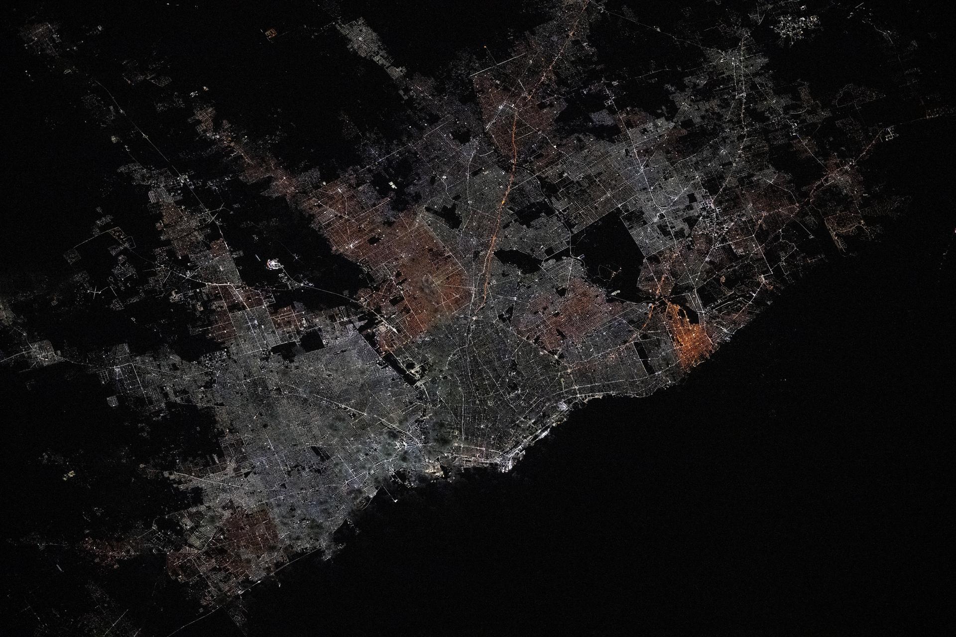 The city lights of Lima, Peru, the South American nation's capital and most populous city with approximately 10.1 million residents on the Pacific coast, are pictured from the International Space Station at approximately 1:43 a.m. local time as it orbited 261 miles above.