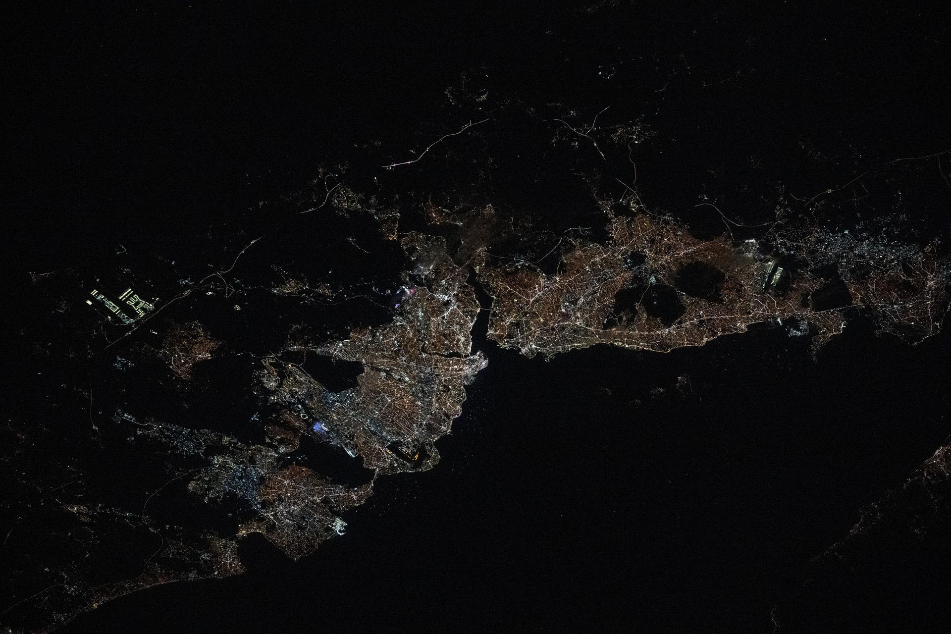 The city lights of Istanbul, Turkiye, with a population of about 15.7 million split by the Bosphorus strait in between the Sea of Mammara and the Black Sea, are pictured at approximately 9:44 p.m. local time from the International Space Staation as it orbited 259 miles above.