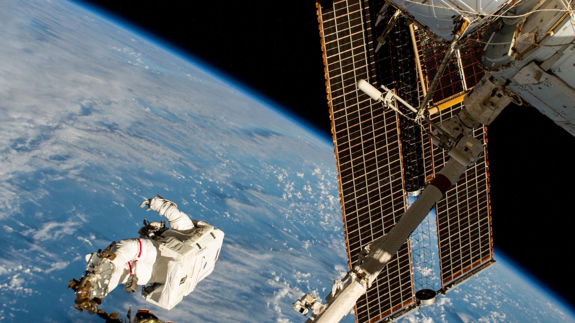 NASA astronaut and Expedition 72 Commander Suni Williams is attached to the Canadarm2 robotic arm's latching end effector while being maneuvered to her worksite 264 miles above the South Pacific Ocean. Williams removed and stowed a radio frequency group antenna assembly during the five-hour and 26-minute spacewalk outside the International Space Station.