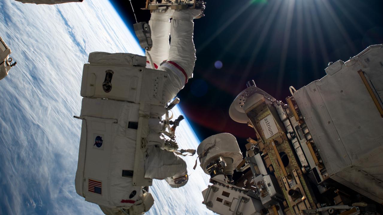iss072e574908 (Jan. 30, 2025) --- NASA astronaut and Expedition 72 Commander Suni Williams seemingly hangs upside down while attached to the Canadarm2 robotic arm's latching end effector during a five-hour and 26 minute spacewalk to remove and stow a radio frequency group antenna assembly. The orbital outpost was soaring 260 miles above Russia near the Sea of Azov at the time of this photograph.