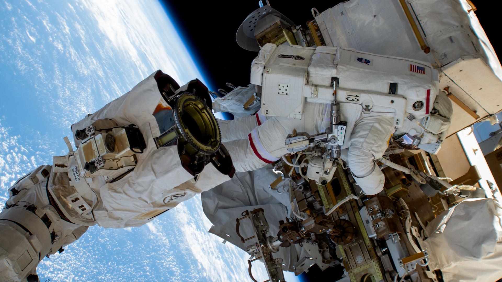 NASA astronaut and Expedition 72 Commander Suni Williams works outside the International Space Station during a five-hour and 26-minute spacewalk to remove and stow a radio frequency group antenna assembly. In the left foreground, is the latching end effector of the Canadarm2 robotic arm. The orbital outpost was soaring 258 miles above the Pacific Ocean near the coast of Mexico at the time of this photograph.