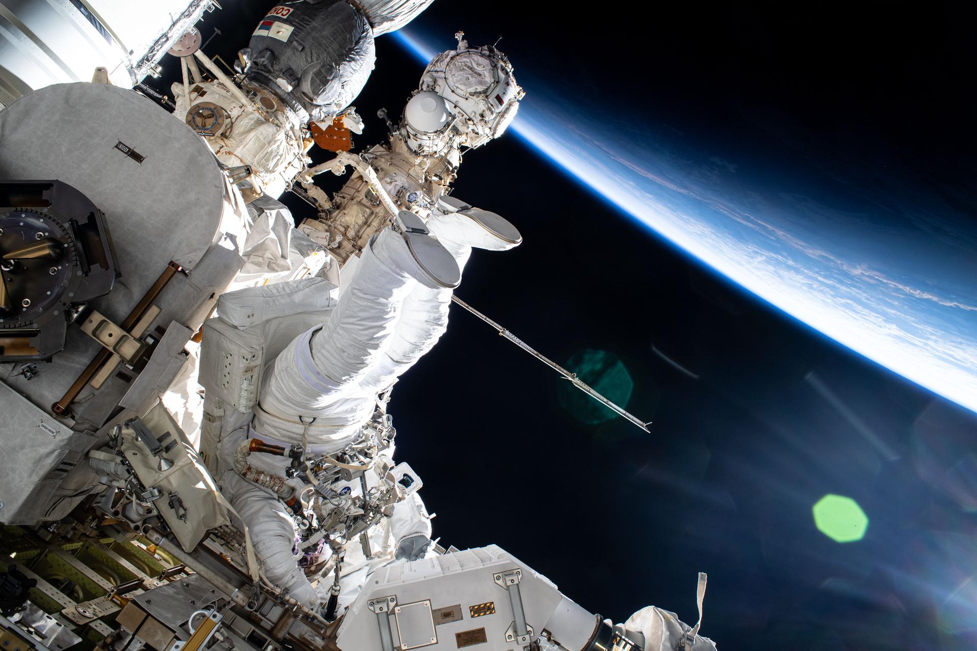 NASA astronaut and Expedition 72 Flight Engineer Butch Wilmore works outside the International Space Station during a five-hour and 26-minute spacewalk. Wilmore swabbed external surfaces searching for microorganisms that may survive and reproduce near vents on the exterior of the orbital outpost. The space station was orbiting into a sunset 259 miles above Eastern Europe at the time of this photograph.