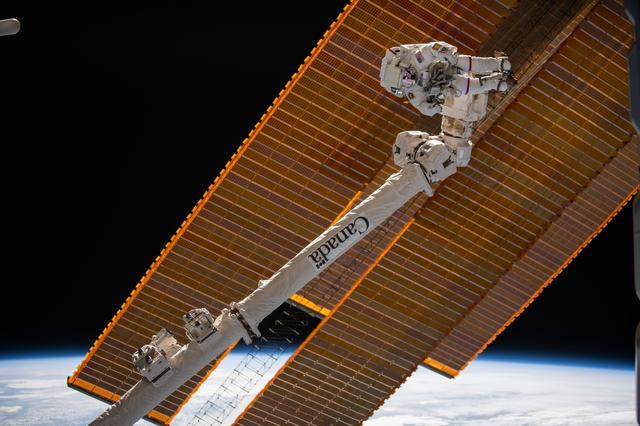 NASA image: Astronaut Suni Williams is attached to the Canadarm2 robotic arm