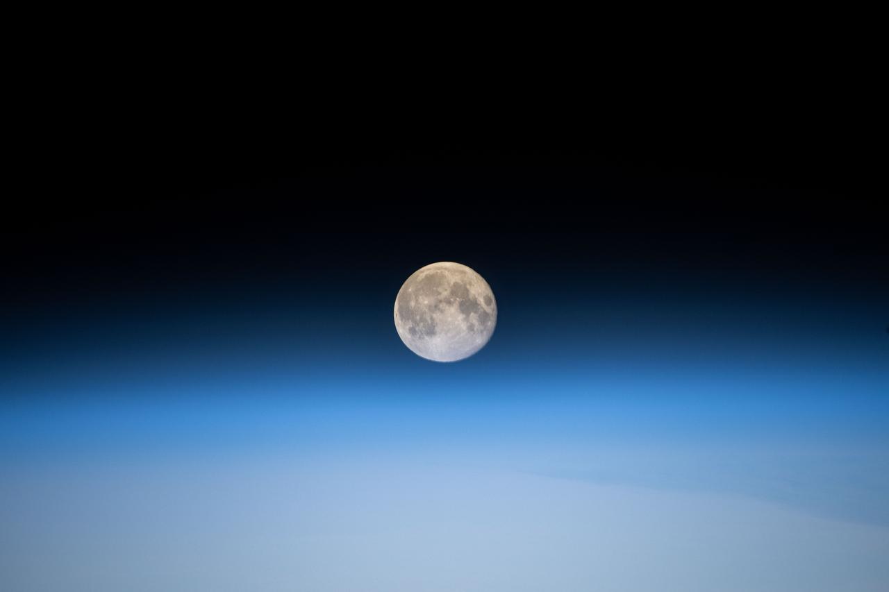 iss072e618284 (Feb. 10, 2025) --- The full Moon is pictured just above Earth's horizon from the International Space Station as it soared 260 miles over Durango, Mexico.