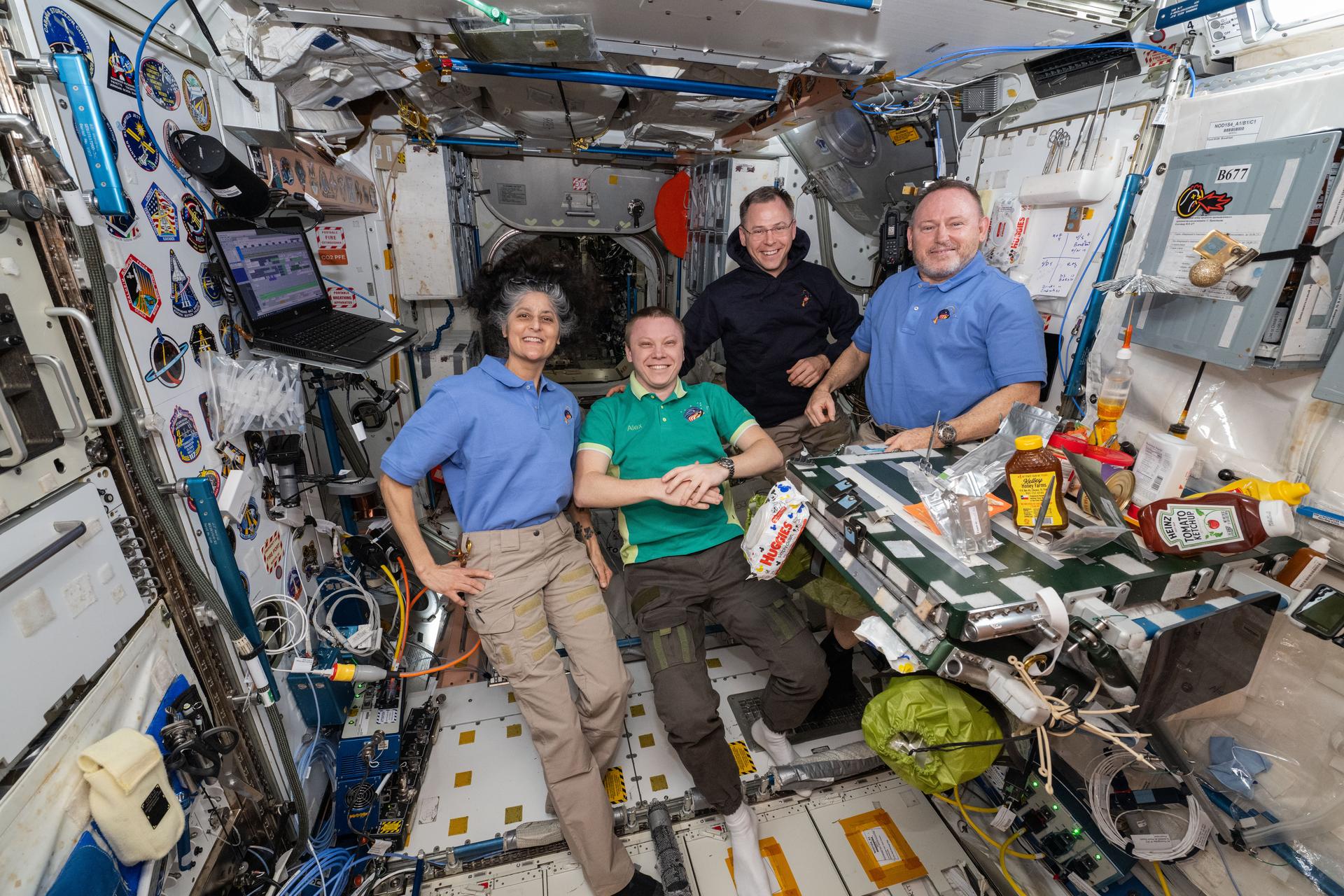 NASA's SpaceX Crew-9 members pose together for a portrait inside the International Space Station's Unity module. From left, are NASA astronaut Suni Williams, Roscosmos cosmonaut Aleksandr Gorbunov, and NASA astronauts Nick Hague and Butch Wimore.