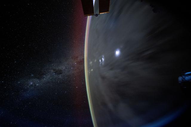 NASA image: The Milky Way appears beyond Earth's horizon