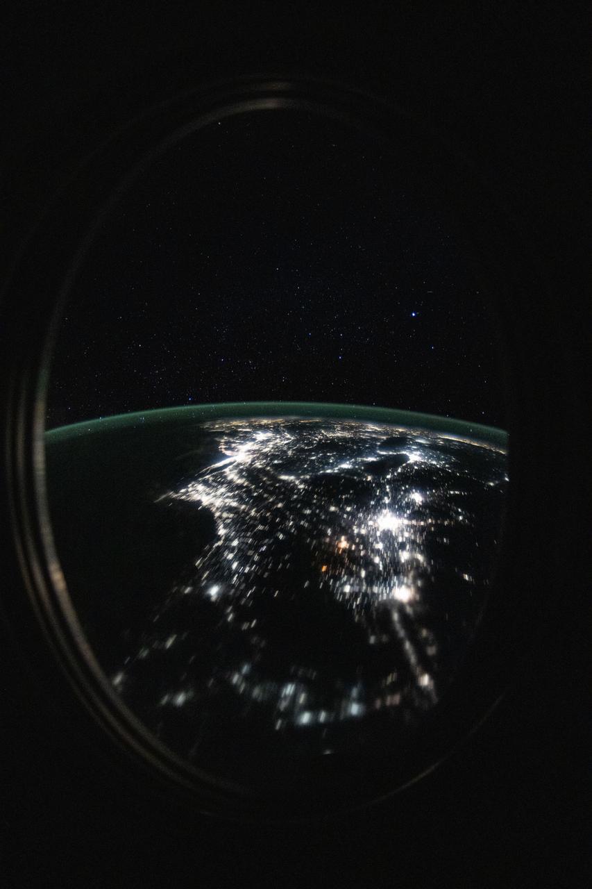 iss072e715420 (March 2, 2025) --- This long-duration photograph looks out a window on the SpaceX Dragon crew spacecraft and down the eastern coast of the United States at approximately 12:34 a.m. local time as the International Space Station orbited 264 miles above Newfoundland, Canada.