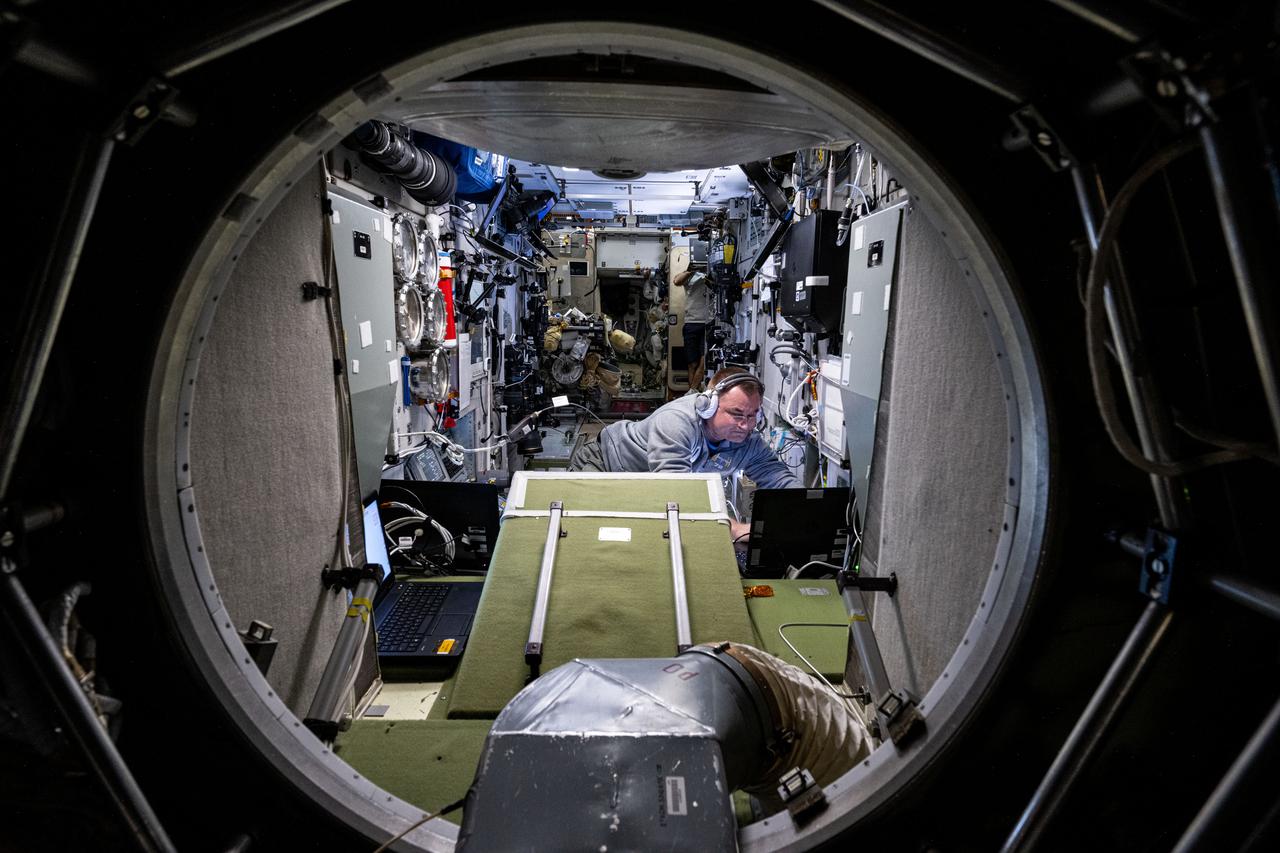 iss072e742442 (March 1, 2025) --- Roscosmos cosmonaut and Expedition 72 Flight Engineer Alexey Ovchinin is pictured at work inside the International Space Station's Zvezda service module.