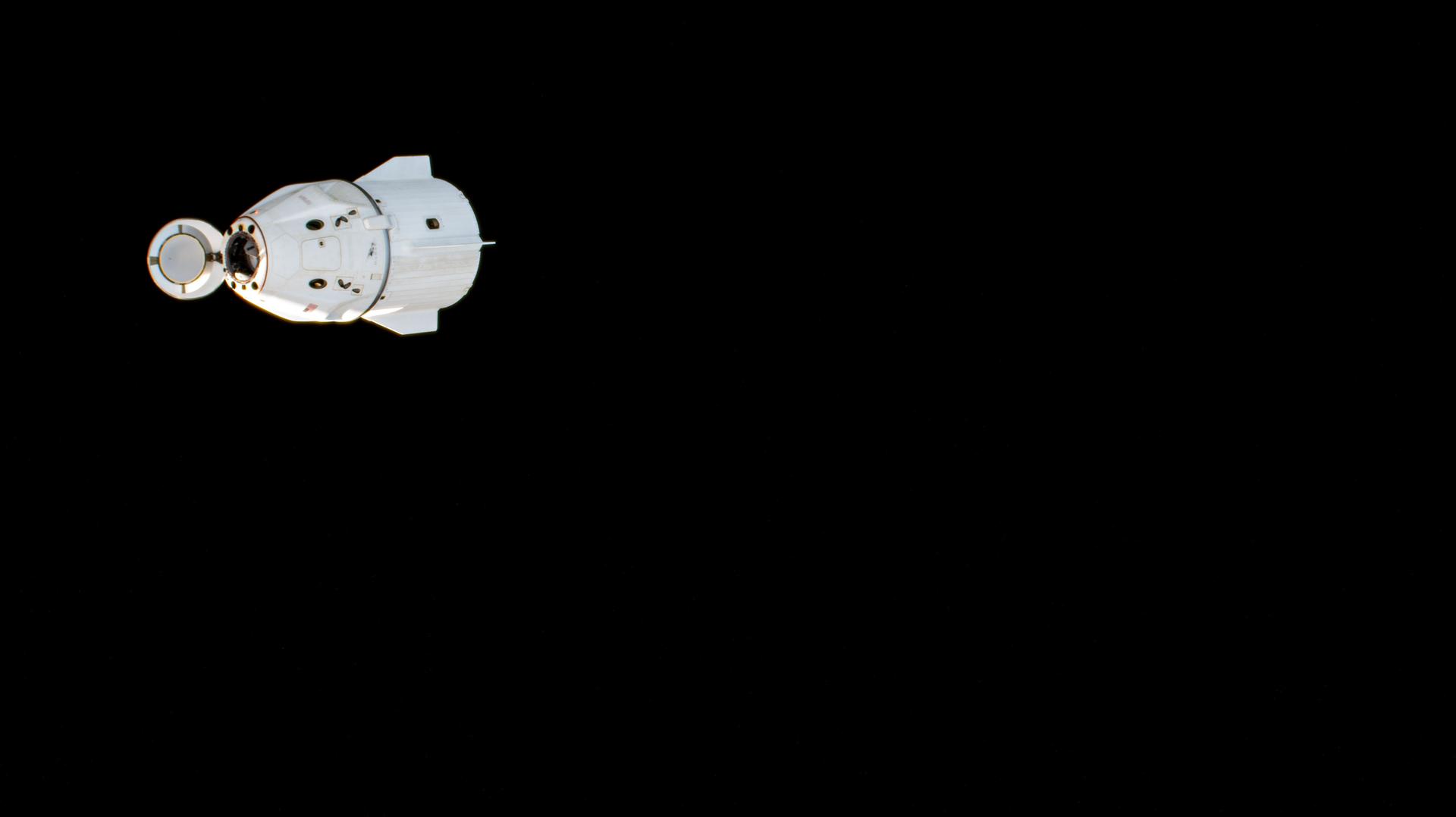 The SpaceX Dragon Freedom spacecraft, with its nose cone open, is pictured shortly after undocking from the International Space Station's space-facing port on the Harmony module. Inside Dragon, were SpaceX Crew-9 Commander Nick Hague with Misssion Specialists Butch Wilmore and Suni Williams, all three from NASA, and Mission Specialist Aleksander Gorbunov from Roscosmos.