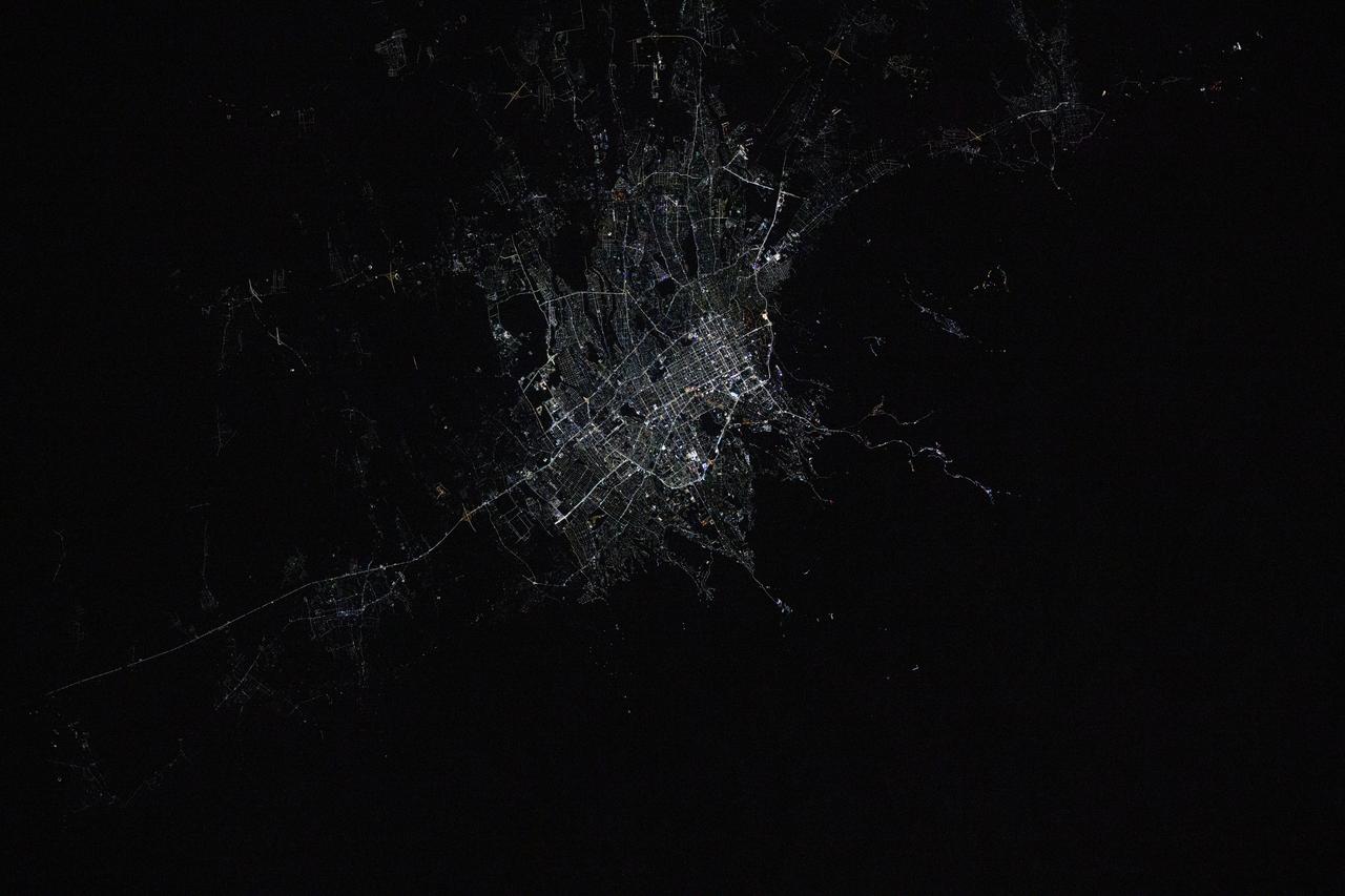 iss072e792891 (March 17, 2025) --- Almaty, Kazakhstan's largest city with a population of about 2.25 million and the second largest city in Central Asia, is pictured at approximately 12:42 a.m. local time from the International Space Station as it orbited 261 miles above.
