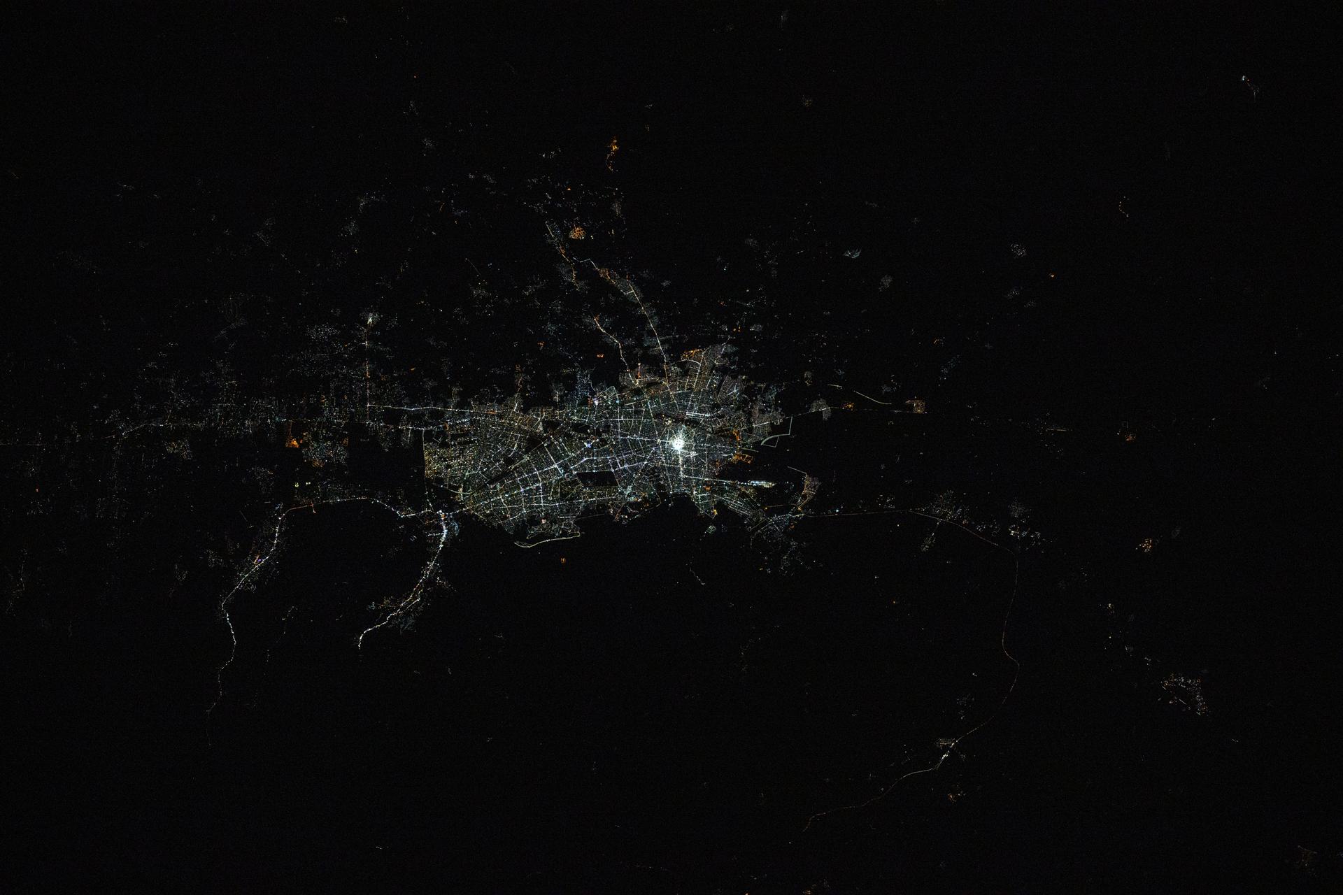 Mashhad, the second-most populous city in Iran with approximately 3.62 million residents near the border with Turkmenistan, is pictured at 11:47 p.m. local time from the International Space Station as it orbited 261 miles above.