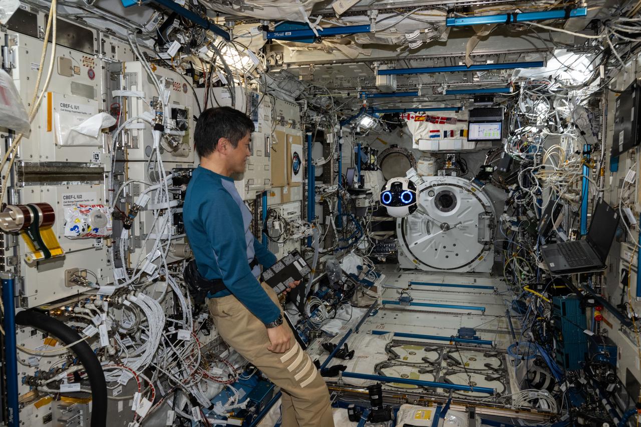 iss072e859359 (March 26, 2025) --- JAXA (Japan Aerospace Exploration Agency) astronaut and Expediion 72 Flight Engineer Takuya Onishi monitors the Japanese Experiment Module Internal Ball Camera 2 aboard the International Space Station's Kibo laboratory module. The spherical, free-flying robotic camera tests the automation of capturing video and imagery enabling more crew time for important duties such as microgravity research.