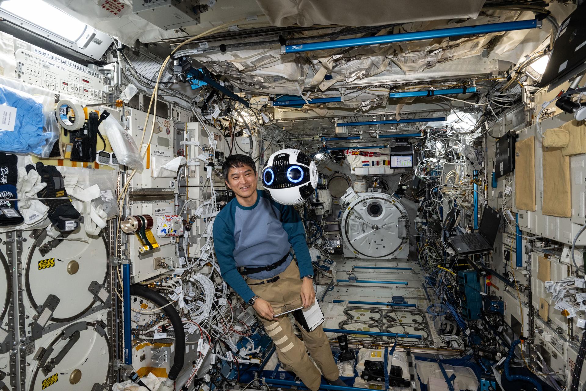 JAXA (Japan Aerospace Exploration Agency) astronaut and Expediion 72 Flight Engineer Takuya Onishi monitors the Japanese Experiment Module Internal Ball Camera 2 aboard the International Space Station's Kibo laboratory module. The spherical, free-flying robotic camera tests the automation of capturing video and imagery enabling more crew time for important duties such as microgravity research.