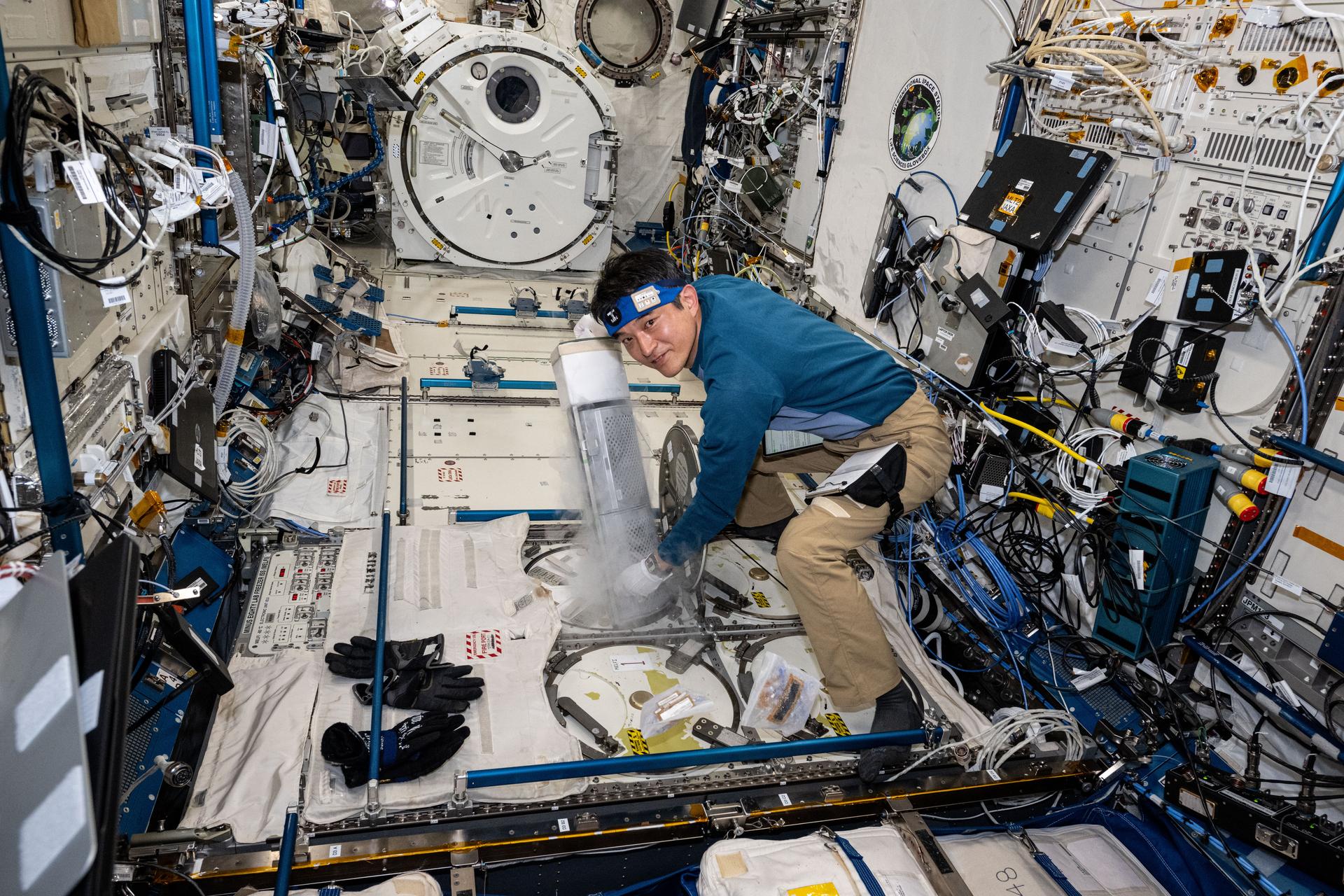 JAXA (Japan Aerospace Exploration Agency) astronaut and Expediion 72 Flight Engineer Takuya Onishi inserts a cryogenic storage unit, called a dewar, containing blood samples collected from a crew member into a science freezer for preservation and later analysis. The Minus Eighty-Degree Laboratory Freezer for International Space Station, or MELFI, is a research freezer that maintains experiment samples at ultra-cold temperatures in microgravity.