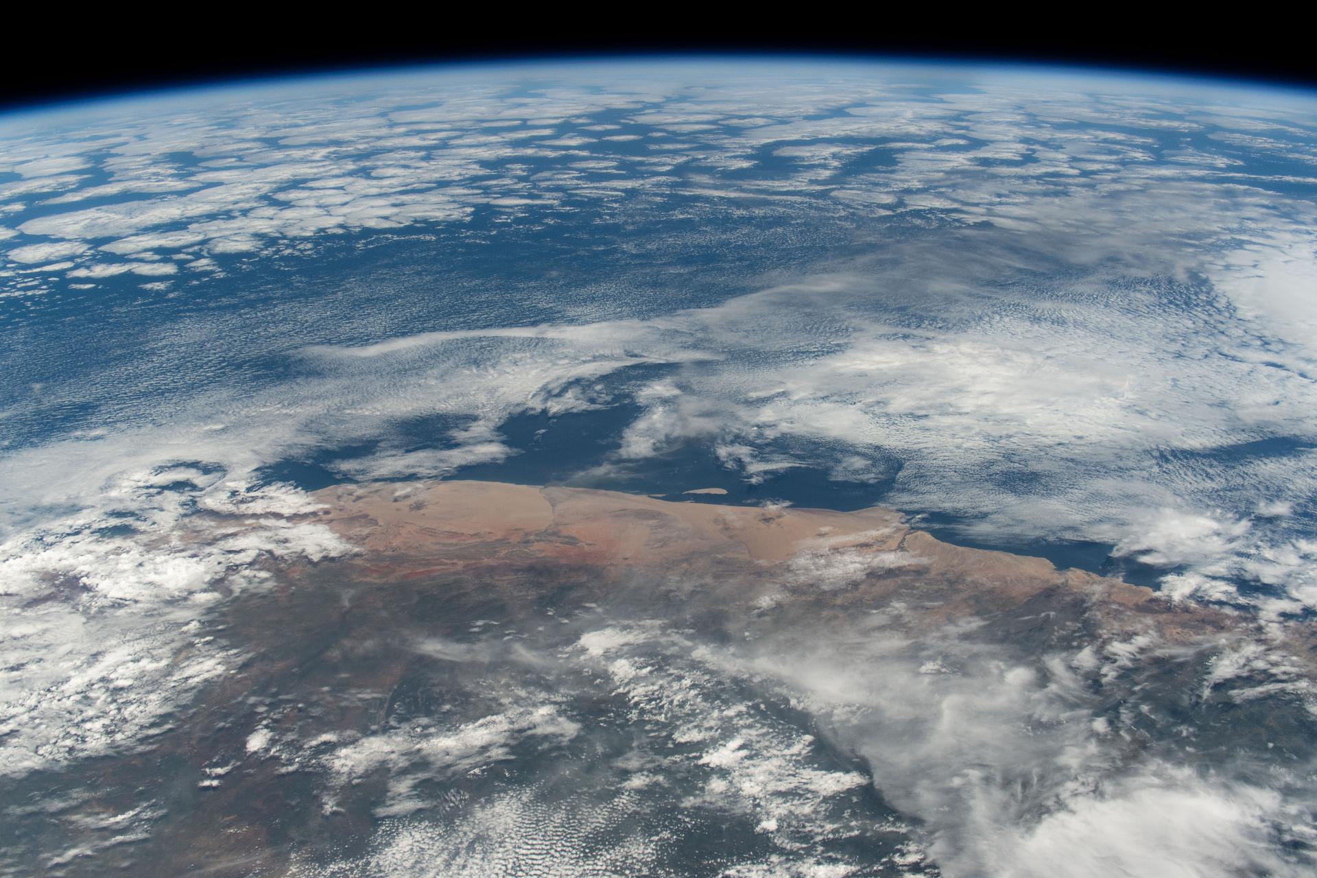 The hot and arid desert coast of Angola on the Atlantic Ocean is pictured from the International Space Station as it orbited 261 miles above the Central African nation.