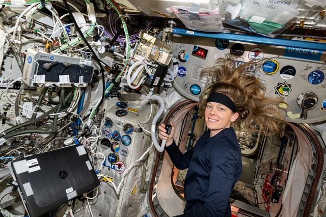 NASA image: Astronaut Nichole Ayers talks on a ham radio with students from Arkansas