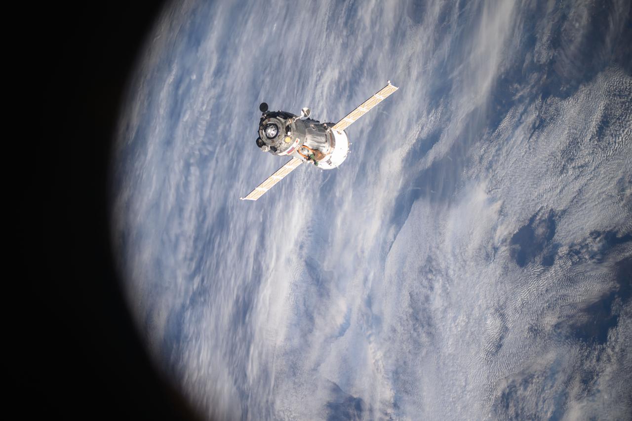 iss073e0000071 (April 19, 2025) --- The Soyuz MS-26 spacecraft is pictured backing away from the International Space Station shortly after undocking from the Rassvet module. The Soyuz crew ship would parachute to a landing in Kazakhstan about three hours later returning NASA astronaut Don Pettit and Roscosmos comonauts Alexey Ovchinin and Ivan Vagner back to Earth after a 220-day space research mission.