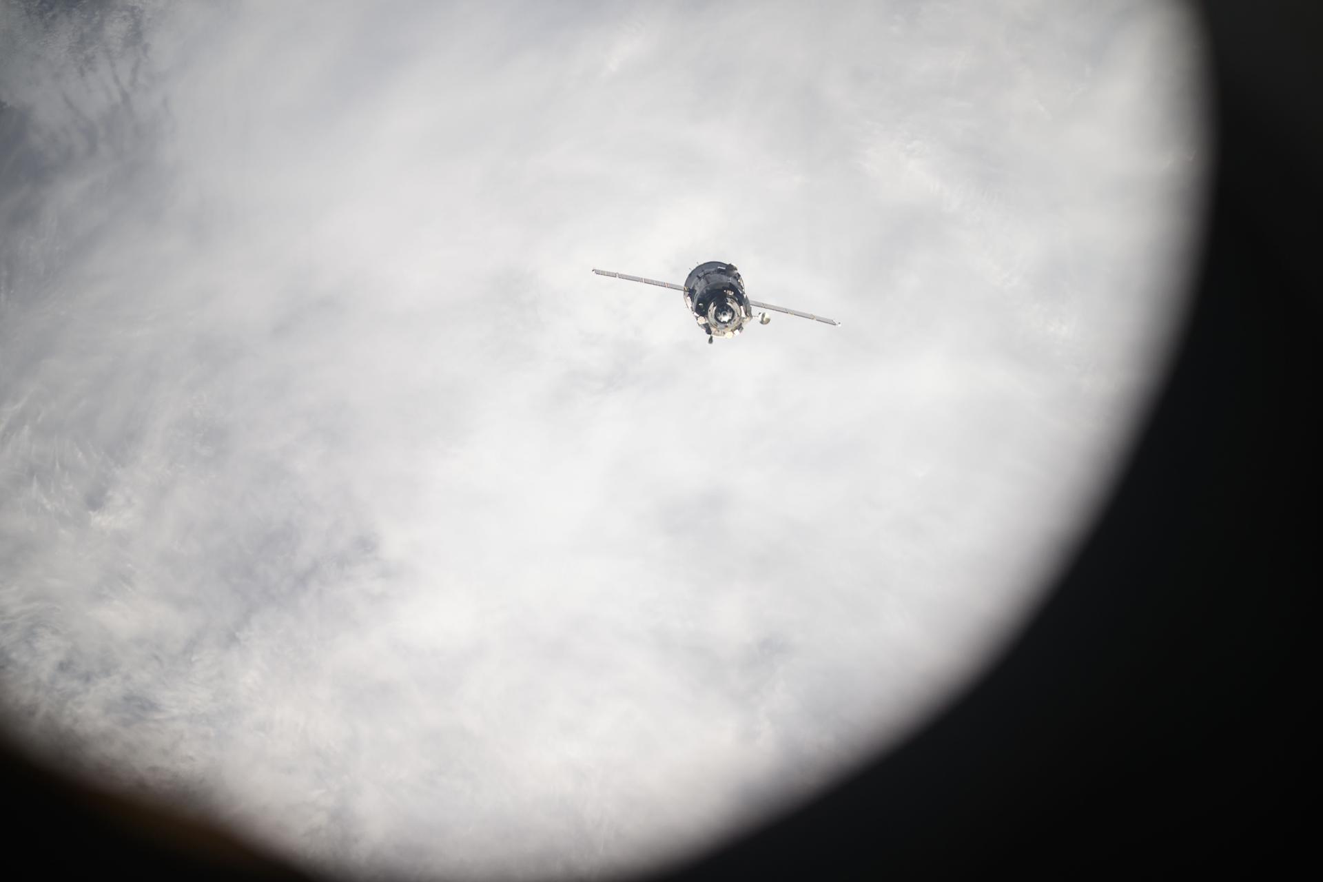The Soyuz MS-26 spacecraft is pictured backing away from the International Space Station shortly after undocking from the Rassvet module. The Soyuz crew ship would parachute to a landing in Kazakhstan about three hours later returning NASA astronaut Don Pettit and Roscosmos comonauts Alexey Ovchinin and Ivan Vagner back to Earth after a 220-day space research mission.