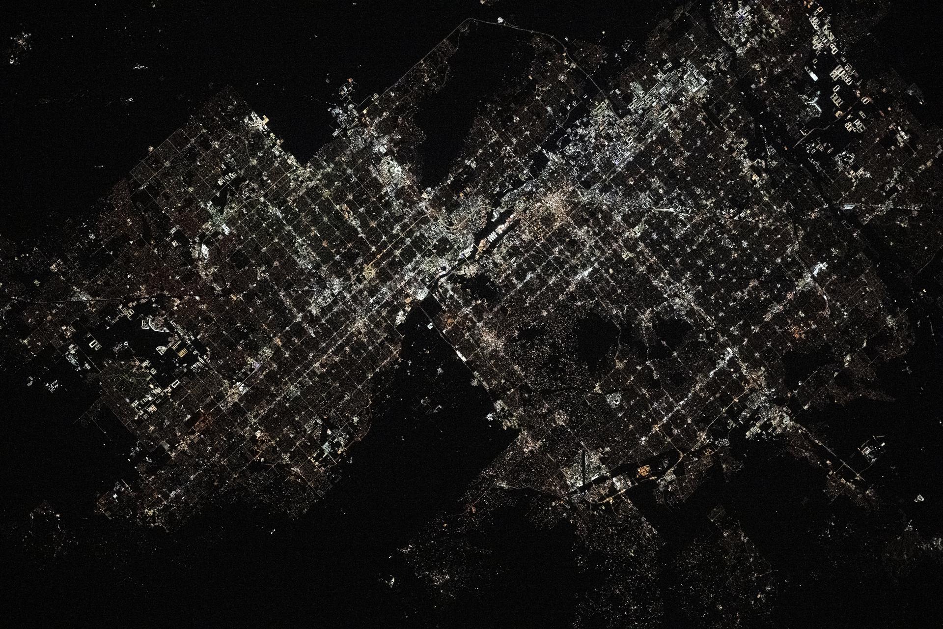 Phoenix, Arizona, with a population of over 1.6 million and surrounded by numerous suburbs, is pictured at approximately 4:13 a.m. local time from the International Space Station as it orbited 259 miles above.