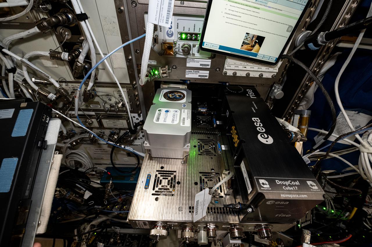 iss073e0001017 (4/23/2025) --- A view of the ICE Cubes Experiment Cube #9 that hosts the Aging in Microgravity investigation installed in the ICE Cubes Facility in the ESA Columbus Laboratory Module. Here, the research team is able monitor the sample temperature and take pictures of the cells directly connecting to the on-board experiment from their laboratory on the ground. Once switched-on, the experiment hardware continuously keeps the sample temperature at 37°C.