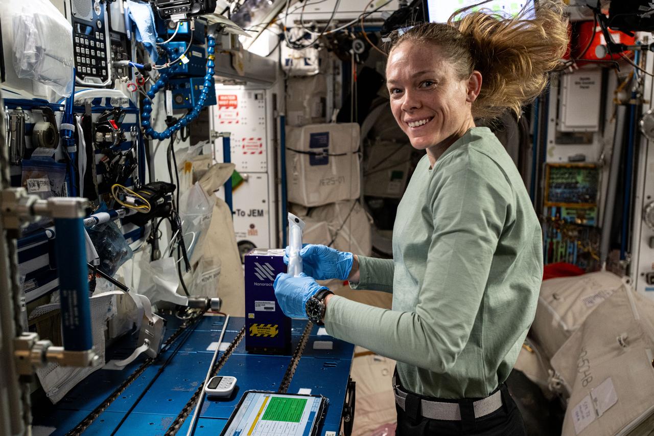 iss073e0001398 (April 23, 2025) --- NASA astronaut and Expedition 73 Flight Engineer Nichole Ayers prepares mixture tubes containing research samples for the Nanoracks Module-9 series of student-designed space experiments. Ayers was working at the Harmony module's maintenance work area aboard the International Space Station.