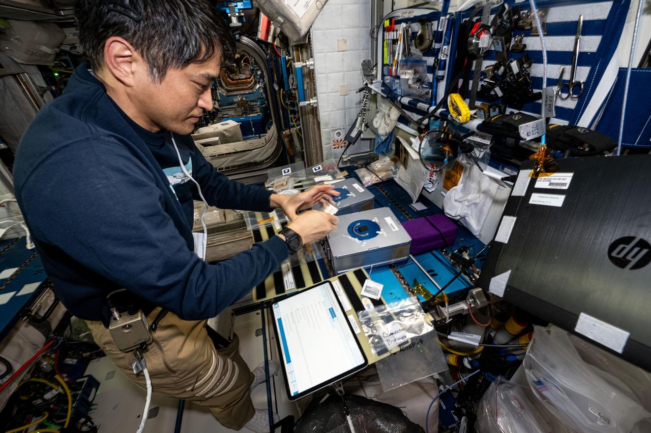 iss073e0002477_alt (April 28, 2025) --- JAXA (Japan Aerospace Exploration Agency) astronaut and Expedition 73 Commander Takuya Onishi processes cassettes containing biological fluid samples for installation inside the Advanced Space Experiment Processor-4, a research facility that can be shipped back and forth from Earth to space, for a biotechnology study.