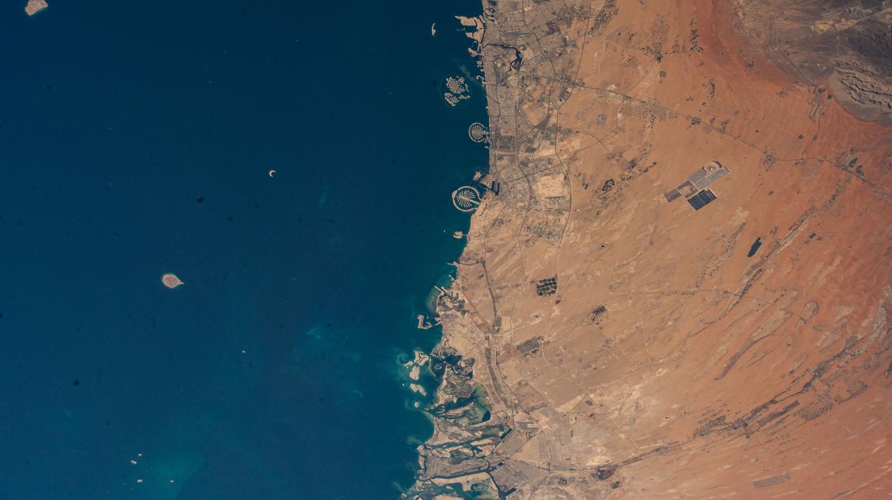 iss073e0003324 (April 30, 2025) --- (From top to bottom) The United Arab Emirates' two most populous cities of Dubai and Abu Dhabi with a combined population of nearly 5.8 million, along with the artificial Palm Islands and the World Islands, on the coast of the Persian Gulf are pictured from the International Space Station as it orbited 260 miles above.