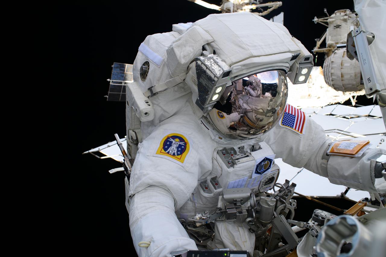 iss073e0008223(May 1, 2025) --- NASA astronaut and Expedition 72 Flight Engineer Nichole Ayers is pictured during a spacewalk to upgrade the orbital outpost's power generation system and relocate a communications antenna.