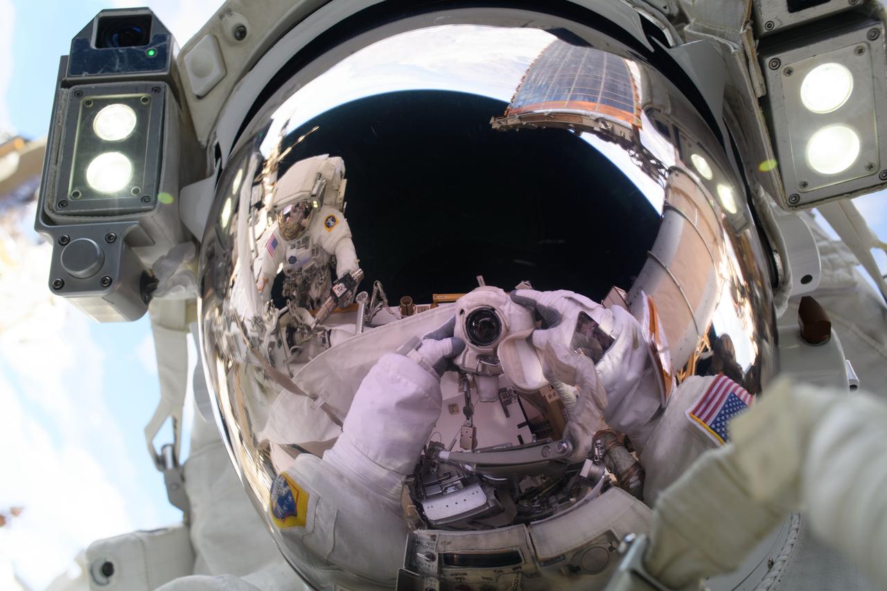 iss073e0008235 (May 1, 2025) --- NASA astronaut and Expedition 72 Flight Engineer Anne McClain points a camera towards herself and takes a "space-selfie" during a spacewalk to upgrade the orbital outpost's power generation system and relocate a communications antenna. Reflected in her helmet's visor is fellow spacewalker and NASA astronaut Nichole Ayers.