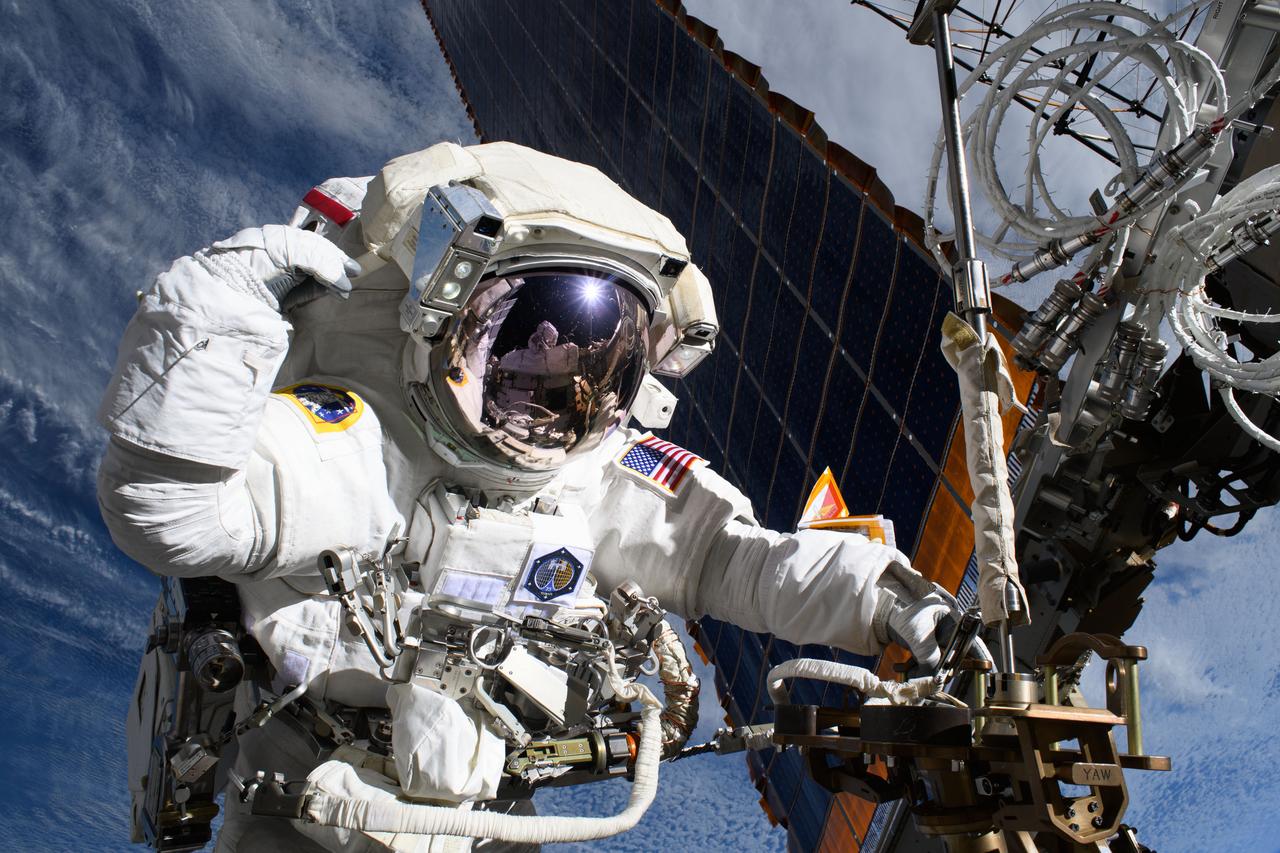 iss073e0008485 (May 1, 2025) --- NASA astronaut and Expedition 72 Flight Engineer Anne McClain is pictured near one of the International Space Station's main solar arrays during a spacewalk to upgrade the orbital outpost's power generation system and relocate a communications antenna.