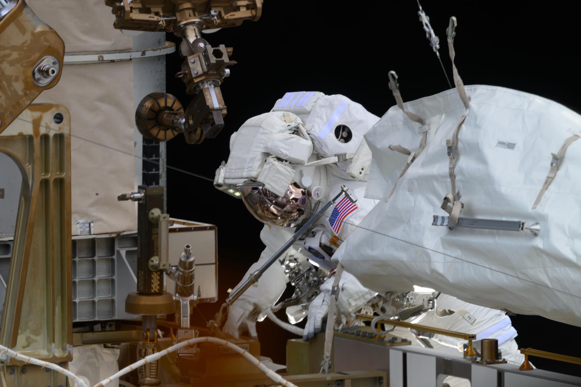 NASA astronaut and Expedition 73 Flight Engineer Nichole Ayers is pictured during a spacewalk to upgrade the International Space Station's power generation system and relocate a communications antenna.