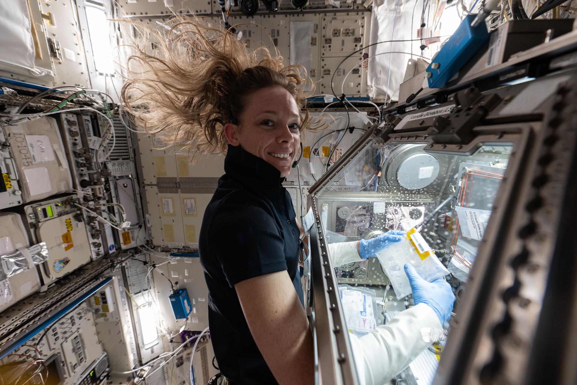NASA astronaut and Expedition 73 Flight Engineer Nichole Ayers works in the Kibo laboratory module's Life Sciences Glovebox processing bacteria samples before viewing them inside a 3D imaging microscope called Extant Life Volumetric Imaging System, or ELVIS. The technology demonstration may enable applications for monitoring water quality, detecting infectious organisms on spacecraft, and researching colloids (suspensions of particles in a liquid) and microorganisms in microgravity.