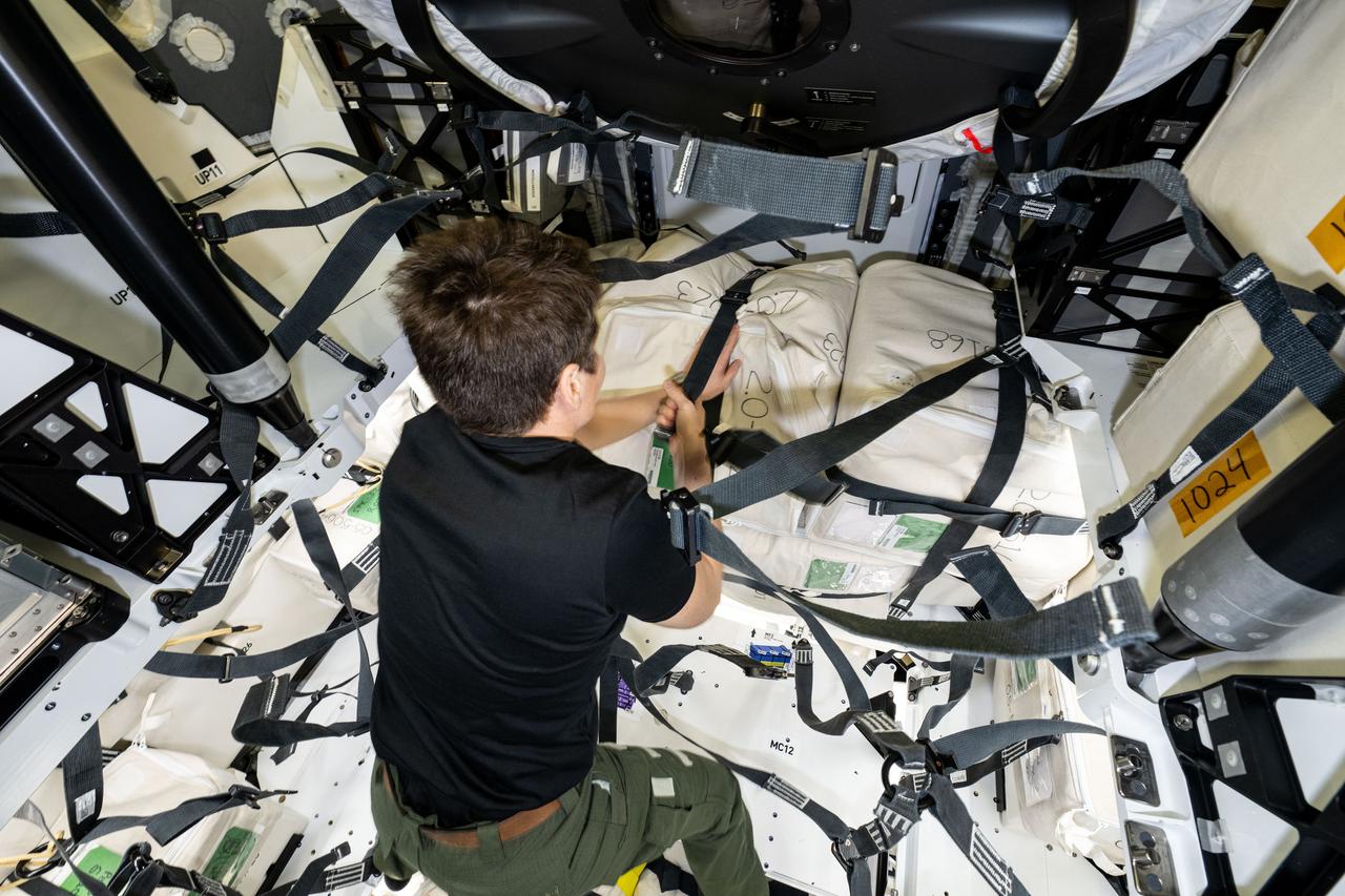 iss073e0032688 (May 16, 2025) --- NASA astronaut and Expedition 73 Flight Engineer Anne McClain works inside the SpaxeX Dragon spacecraft loading and securing cargo for the return to Earth scheduled for May 22, 2025.