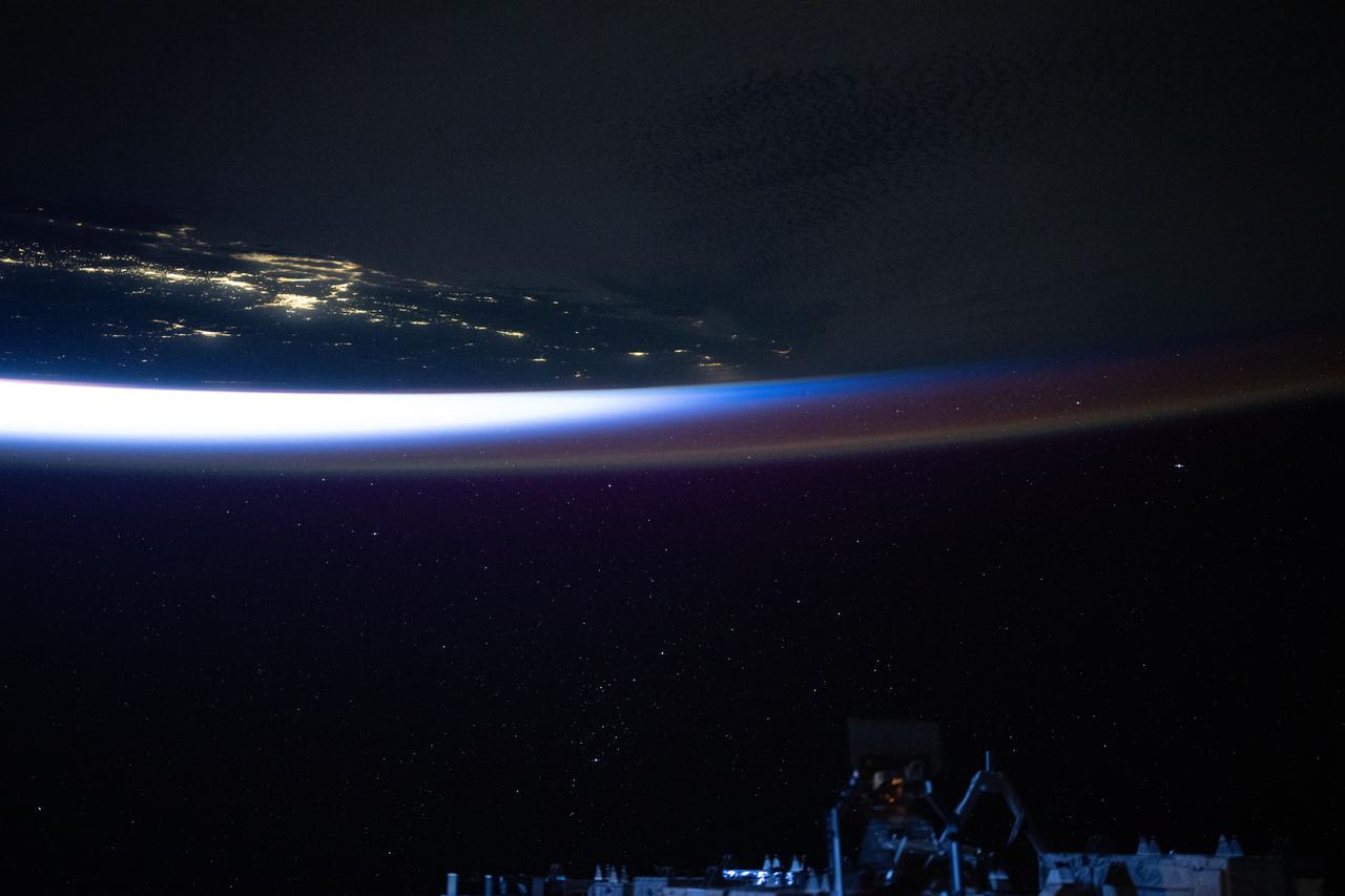 iss073e0035649 (April 20, 2025) --- An orbital twilight reveals Earth's horizon and contrasts with the well-lit coast of southern California in this photograph from the International Space Station as it orbited 258 miles above the Pacific Ocean at approximately 4:46 a.m. local time.