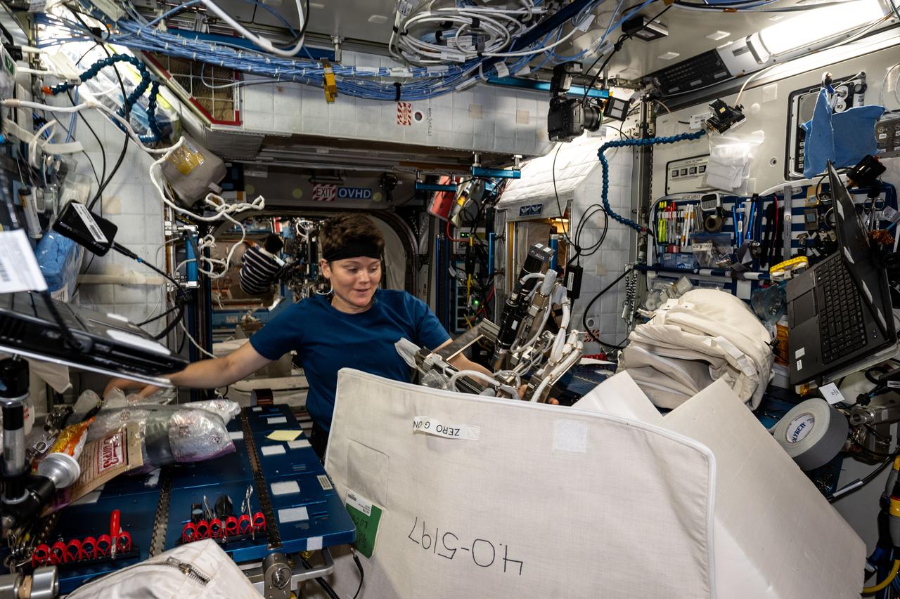 iss073e0071119 (May 14, 2025) --- NASA astronaut and Expedition 73 Flight Engineer Anne McClain works inside the International Space Station's Harmony module gathering and organizing cargo to be packed inside the SpaceX Dragon cargo spacecraft before its departure.