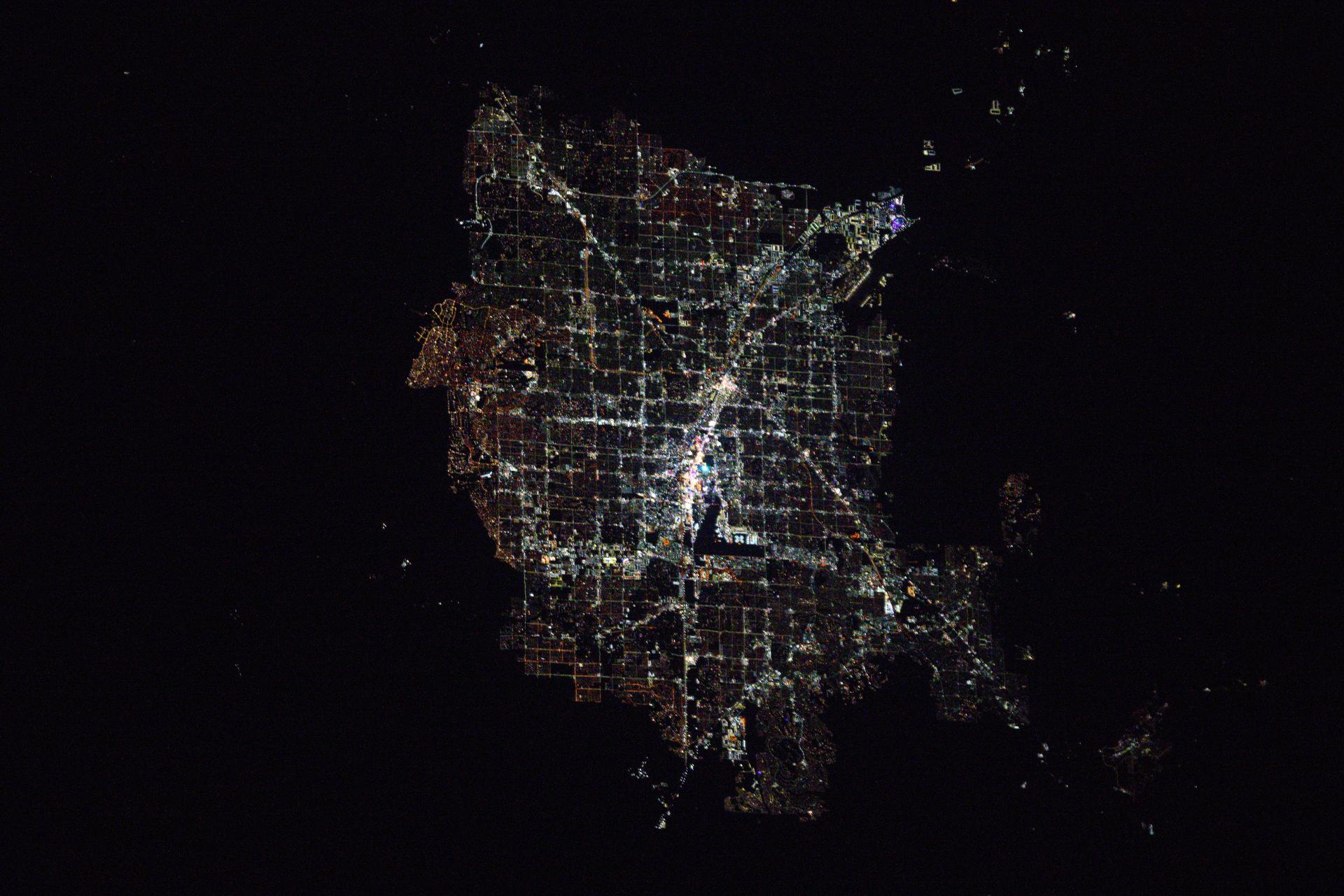 Las Vegas, Nevada, with a metropolitan population of 2.26 million, and its well-lit strip situated next to Harry Reid International Airport, is pictured at approximately 1:54 a.m. local time from the International Space Station as it orbited 260 miles above.