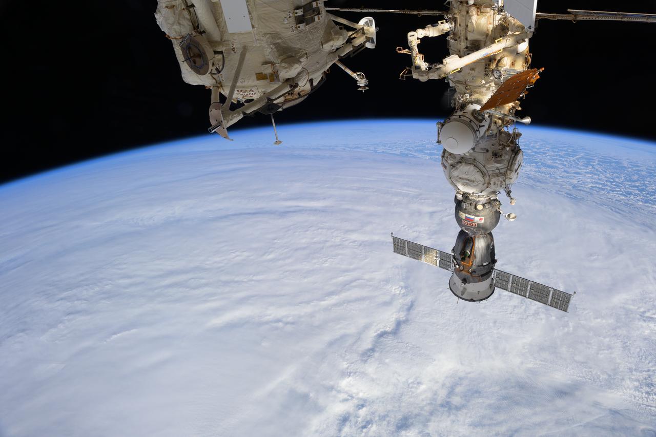iss073e0075996 (May 15, 2025) --- The Soyuz MS-27 crew ship is pictured docked to the International Space Station's Prichal module as the orbital outpost soared 271 miles above a cloudy South Pacific Ocean. The Soyuz MS-27 launched from Kazakhstan's Baikonur Cosmodrme then docked to Prichal on April 8, 2025, carrying Expedition 73 Flight Engineers Jonny Kim of NASA and Sergey Ryzhikov and Alexey Zubritsky, both from Roscosmos.