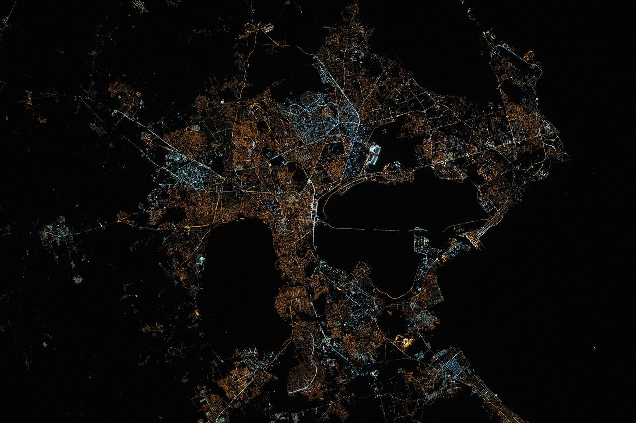 iss073e0078538 (May 17, 2025) --- The city lights of Tunis, the capital of the north African nation of Tunisia with a metropolitan population of 2.67 million, contrast the city's historical and modern character in this photograph at approximately 12:34 a.m. local time from the International Space Station as it orbited 260 miles above the Mediterranean Sea. Tunis sits in between the Lake of Tunis and the Sebkhet Sejoumi, a seasonal salt flat, and is situated on the Gulf of Tunis.