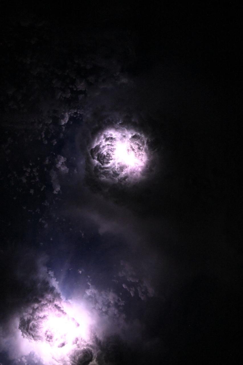 iss073e0081060 (May 15, 2025) --- This nebula-like formation is actually lightning illuminating the clouds during a storm off the coast of North Carolina in this photograph from the International Space Station as it orbited 260 miles above the Atlantic Ocean.