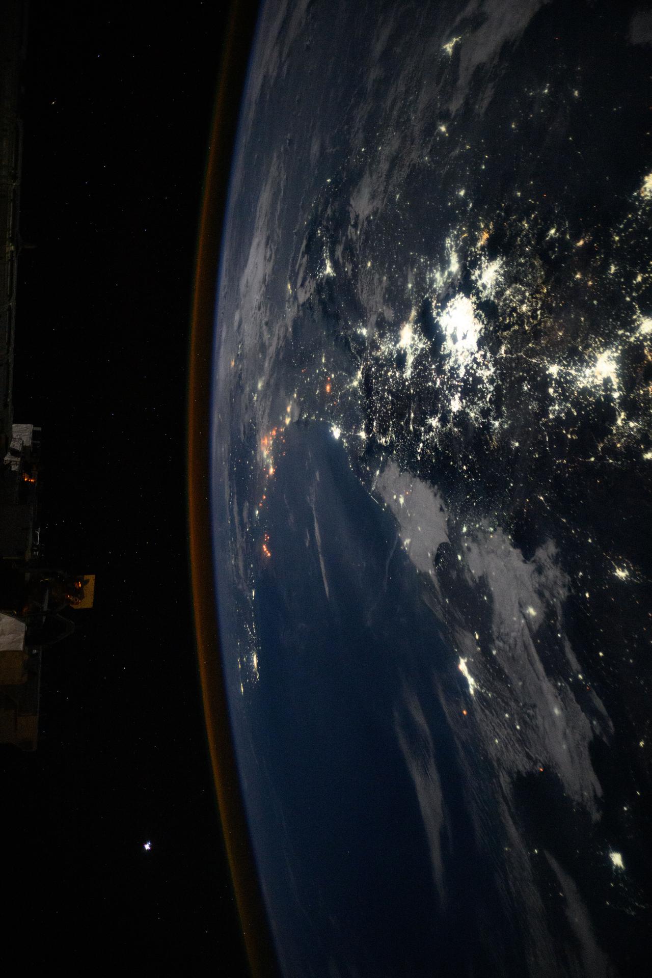 The International Space Station was soaring 259 miles above central Mexico with a faint atmospheric glow crowning Earth's horizon at approximately 2:58 a.m. local time when this photograph was taken. The city lights of Mexico City, the nation's capital and largest city with a population of 9.21 million, and its surrounding suburbs dominate the nightscape.