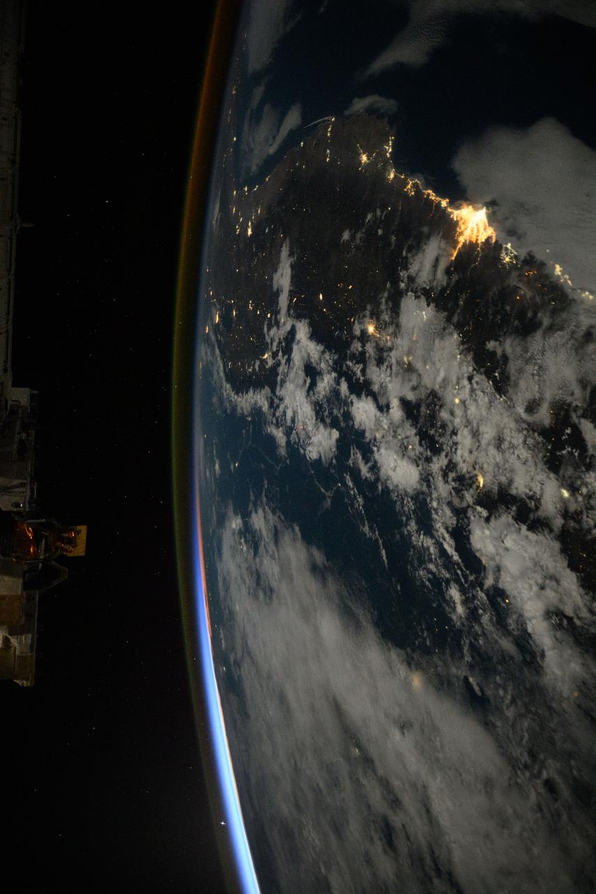 iss073e0089435 (May 16, 2025) --- The International Space Station was soaring 261 miles above the Pacific coast of South America into an orbital sunrise at approximately 4:09 a.m. local time when this photograph was taken. Lima (upper right), Peru's capital and largest city with a population of 10.1 million, represents the brightest lights on the Peruvian coast.