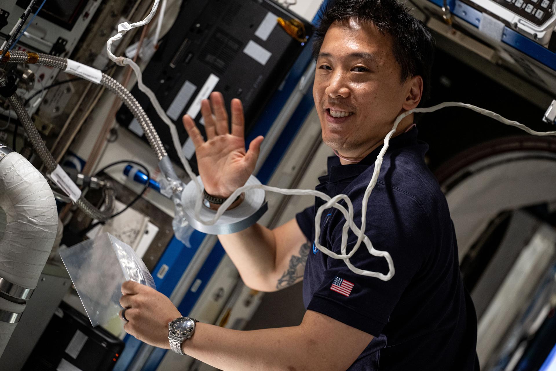 NASA astronaut and Expedition 73 Flight Engineer Jonny Kim services an experimental carbon dioxide removal device aboard the International Space Station. Also called the Thermal Amine Scrubber, the advanced life support mechanism is testing a new method that removes carbon dioxide from the station’s atmosphere and recovers water for oxygen generation.