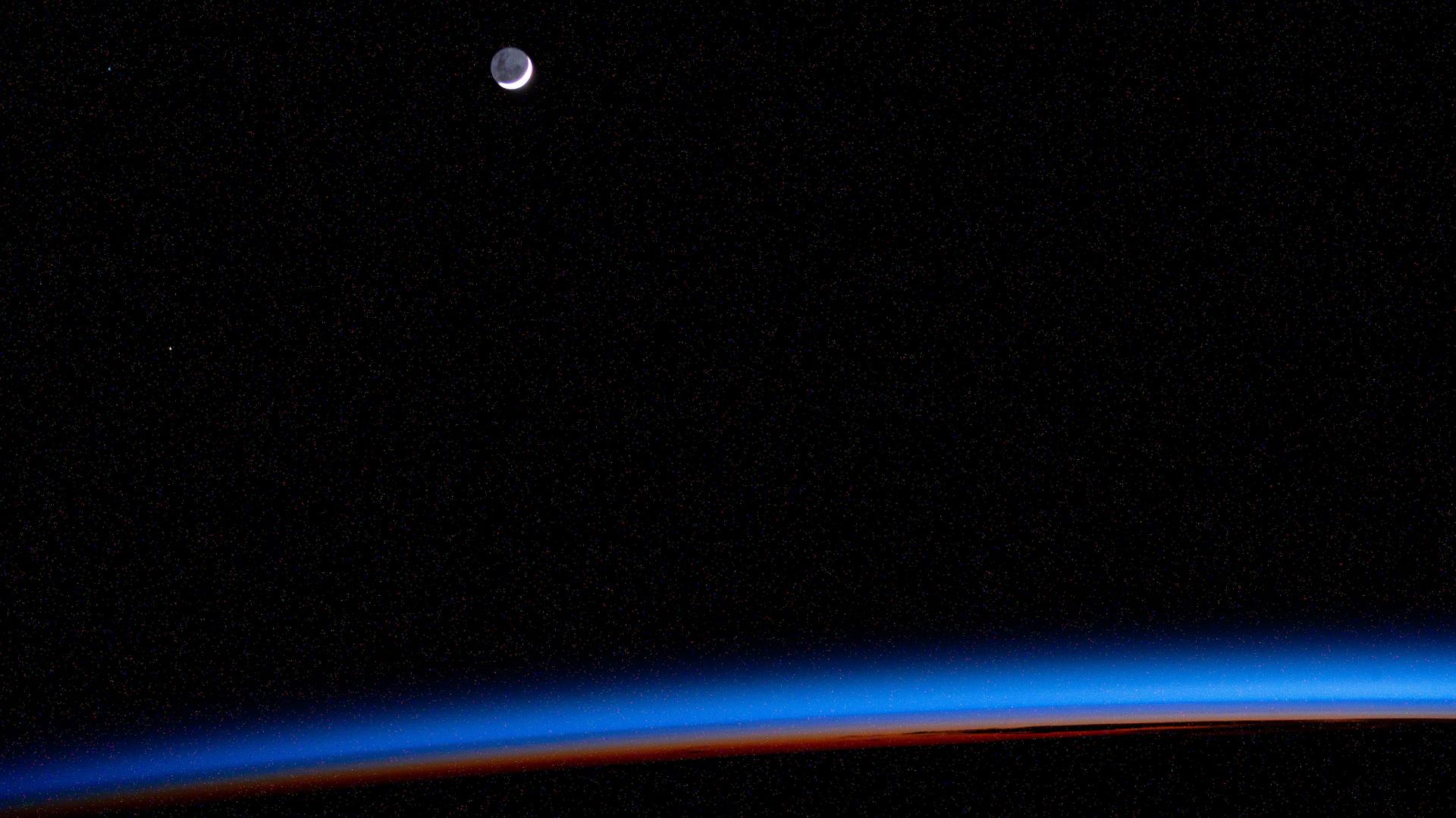 An external high definition camera adjusted for night sensitivity took this photograph of the waning crescent Moon above Earth's horizon as the International Space Station orbited into a sunrise 270 miles above the Atlantic Ocean.