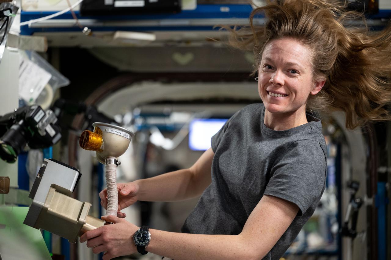 iss073e0118757 (May 29, 2025) --- NASA astronaut and Expedition 73 Flight Engineer Nichole Ayers cleans and services life support components that are part of the Oxygen Generation System rack located inside the International Space Station's Destiny laboratory module.