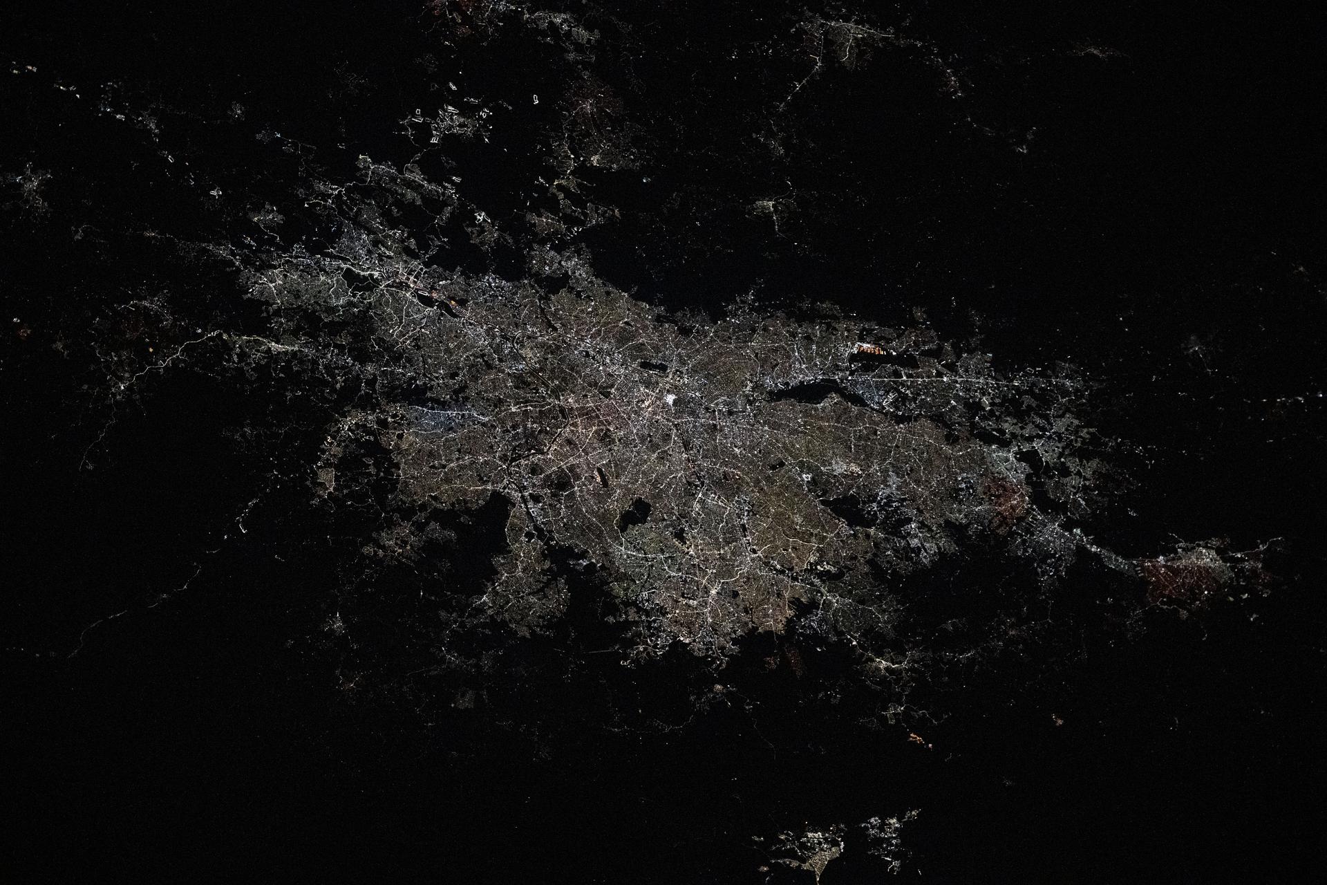 São Paulo, Brazil, the South American nation's largest city with a population of about 11.9 million, and its surrounding suburbs including Guarulhos, with a population of about 1.29 million, are pictured at approximately 3:54 a.m. local time from the International Space Station as it orbited 265 miles above the Atlantic Ocean.