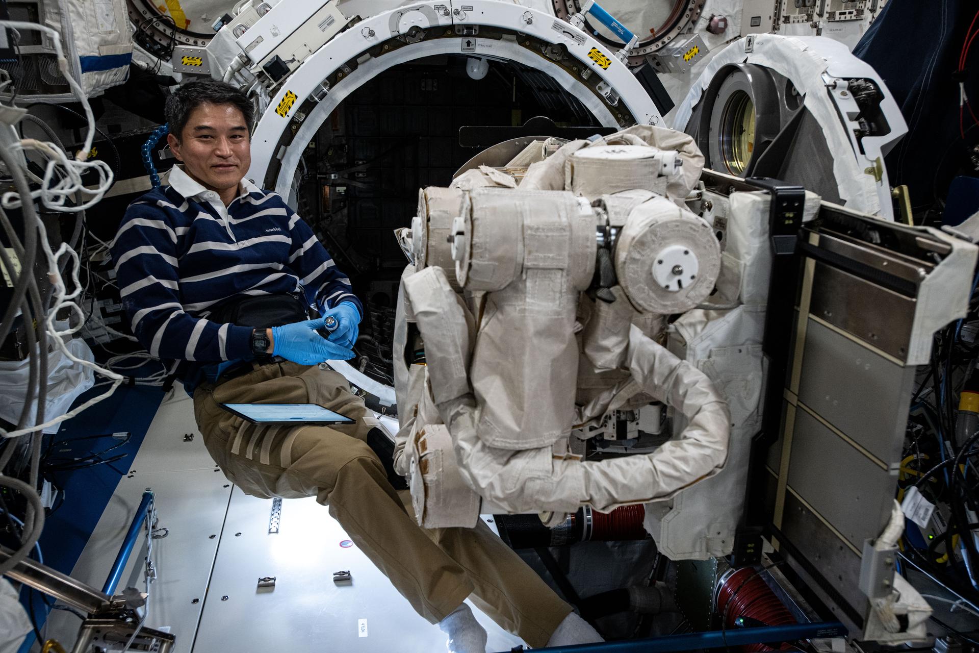 JAXA (Japan Aerospace Exploration Agency) astronaut and Expedition 73 Commander is pictured during maintenance operations on the Japanese robotic arm's Small Fine Arm inside the Kibo laboratory module. The Small Fine Arm is used for precise and dexterous robotic maneuvers when grappling small components or payloads on the outside of the International Space Station. There are two other robotic arms on the outside of the orbital outpost including the Canadarm2 robotic arm and the European robotic arm (ERA). Canadarm2 can be used to maneuver spacecraft, spacewalkers, and large payloads. ERA can also be used to maneuver spacewalkers and space station components.