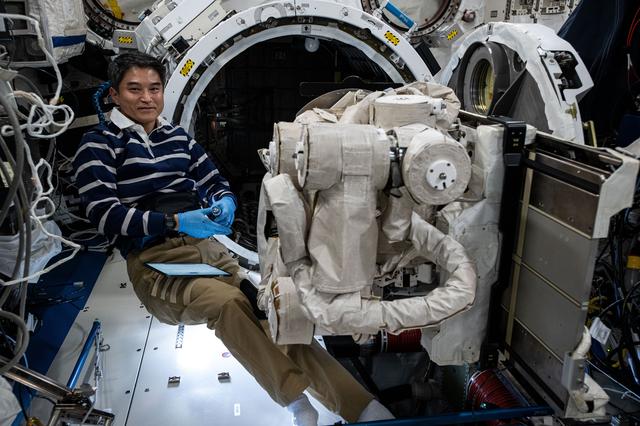 NASA image: JAXA astronaut works on the Japanese robotic arm's Small Fine Arm